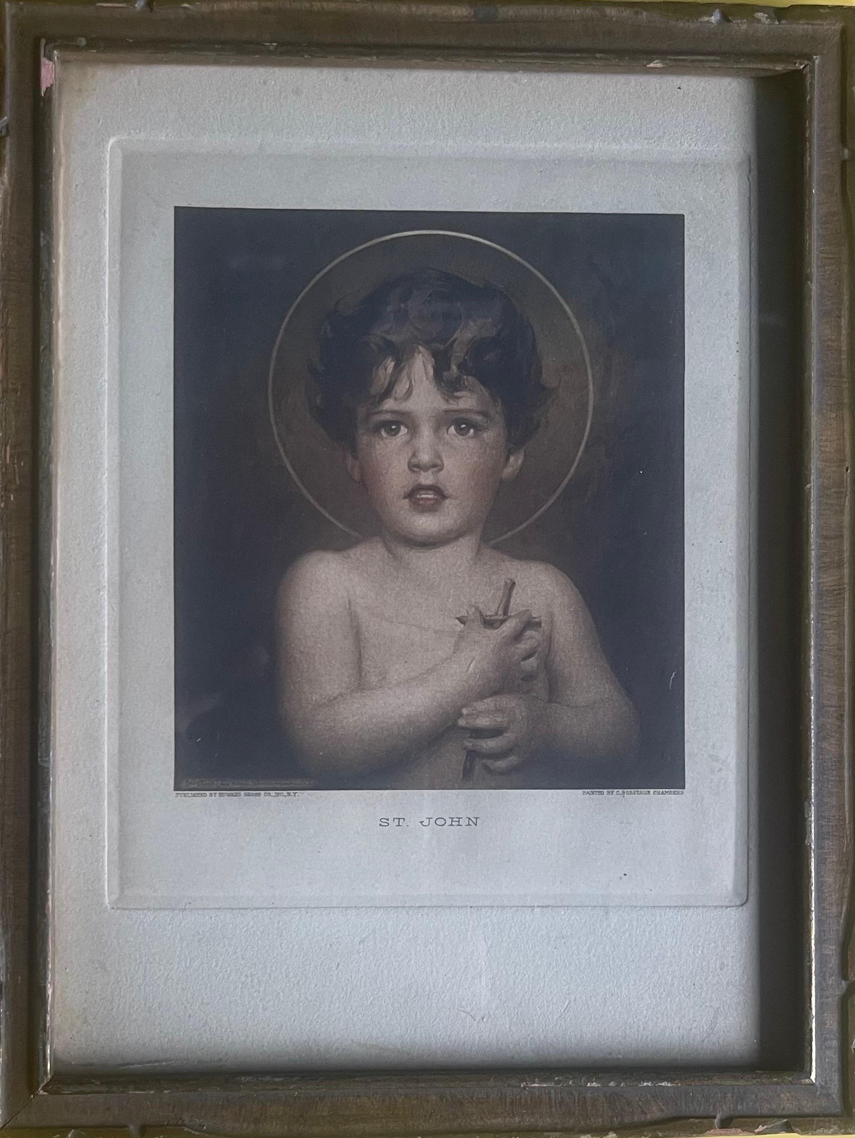 Highly collectible vintage lithograph print of original painting by American artist Charles Bosseron Chambers, circa 1930s. The iconic image depicts St John the Baptist as a cherubic young boy, holding a wooden crucifix to his heart. The print is a