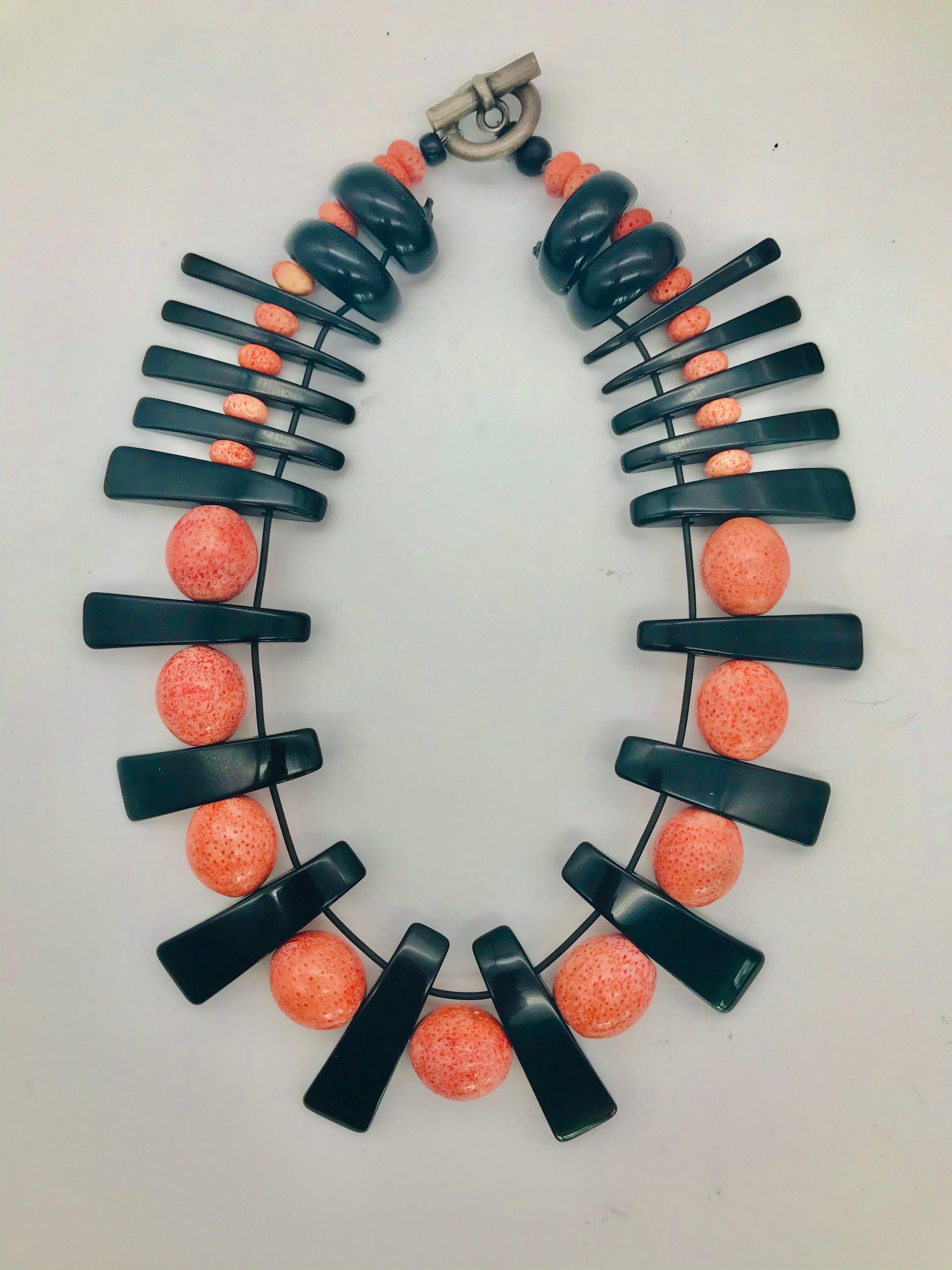 This Necklace was up-cycled from Vintage Salmon Color Coral and Black Lucite Beads into a new contemporary look. I do not purchase any more Coral, because it is very much endangered. I only use old beads and therefore it is not a part of one of my