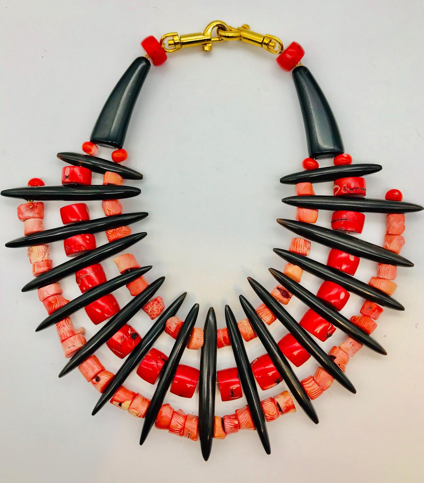 Salmon and Red Coral with black Resin spacers Statement Necklace has been up-cycled from vintage materials . The salmon color Coral is possibly from Croatia? The red coral is typical of Pacific  coral
Corals are animals that live in the world’s