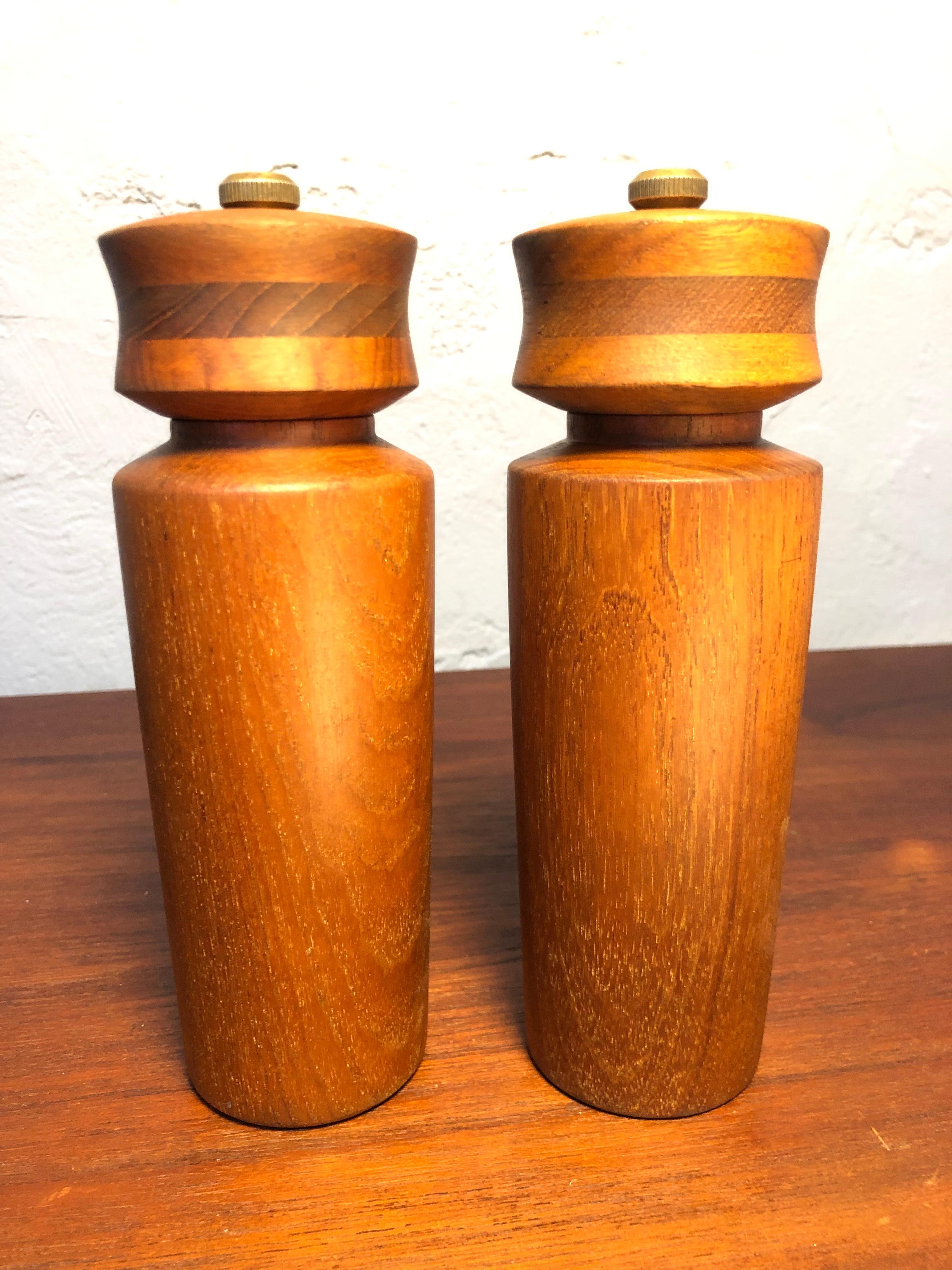 Vintage salt and pepper mills by Dane Wood of Denmark in lovely midcentury design and Classic Scandinavian quality.
Turned teak. 
These mills have been dismantled clean sanded and waxed. 

 