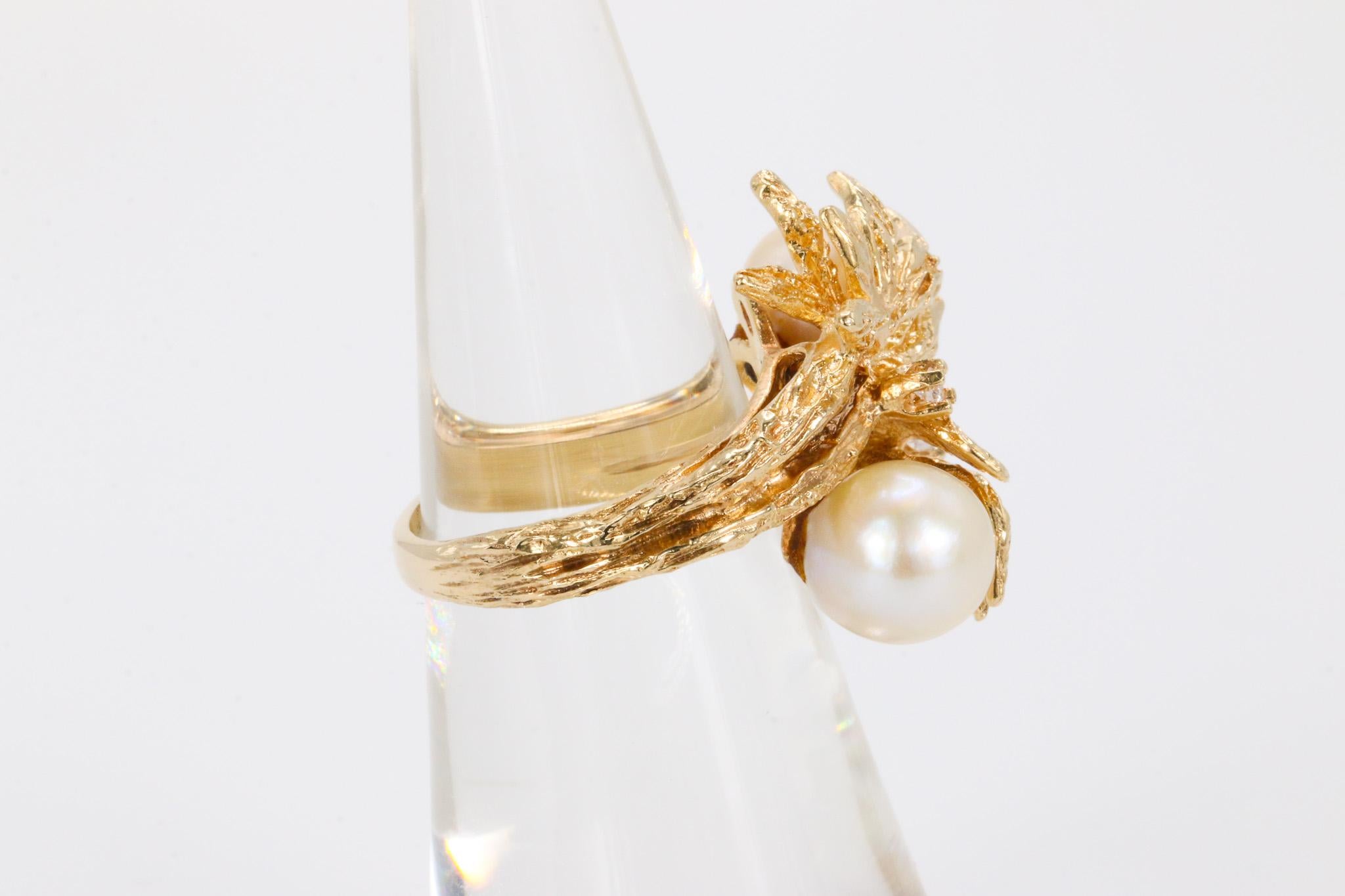 Vintage Salt Water Pearl and Round Brilliant Diamond in 14k Yellow Gold Ring

This exquisite vintage ring features a graceful combination of natural saltwater pearls and brilliant round-cut diamonds, artfully set in 14K yellow gold. Elegant and