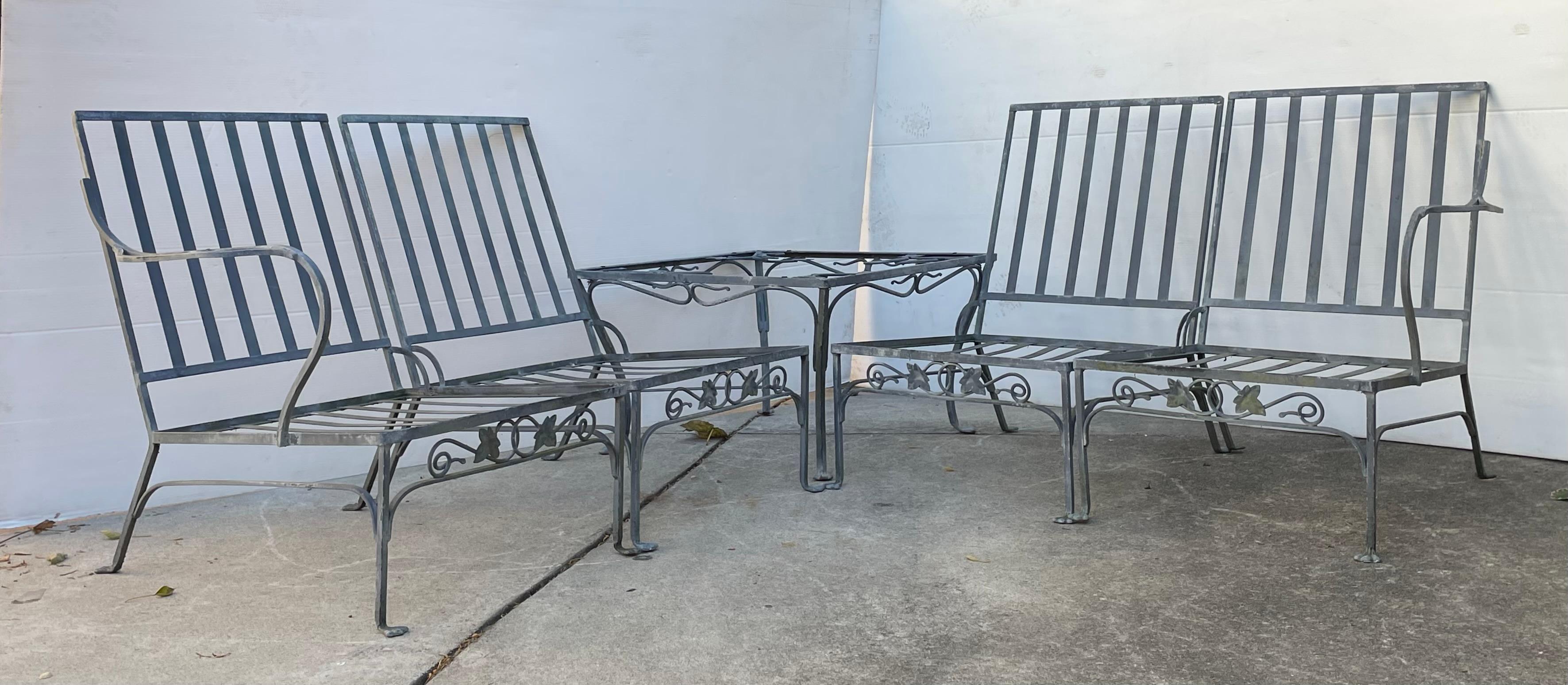 Five piece original 1960s Salterini ivy leaf wrought iron modular outdoor sofa with back & seat cushions. Cushions will need to be reupholstered table comes with a new tempered piece of glass for top.