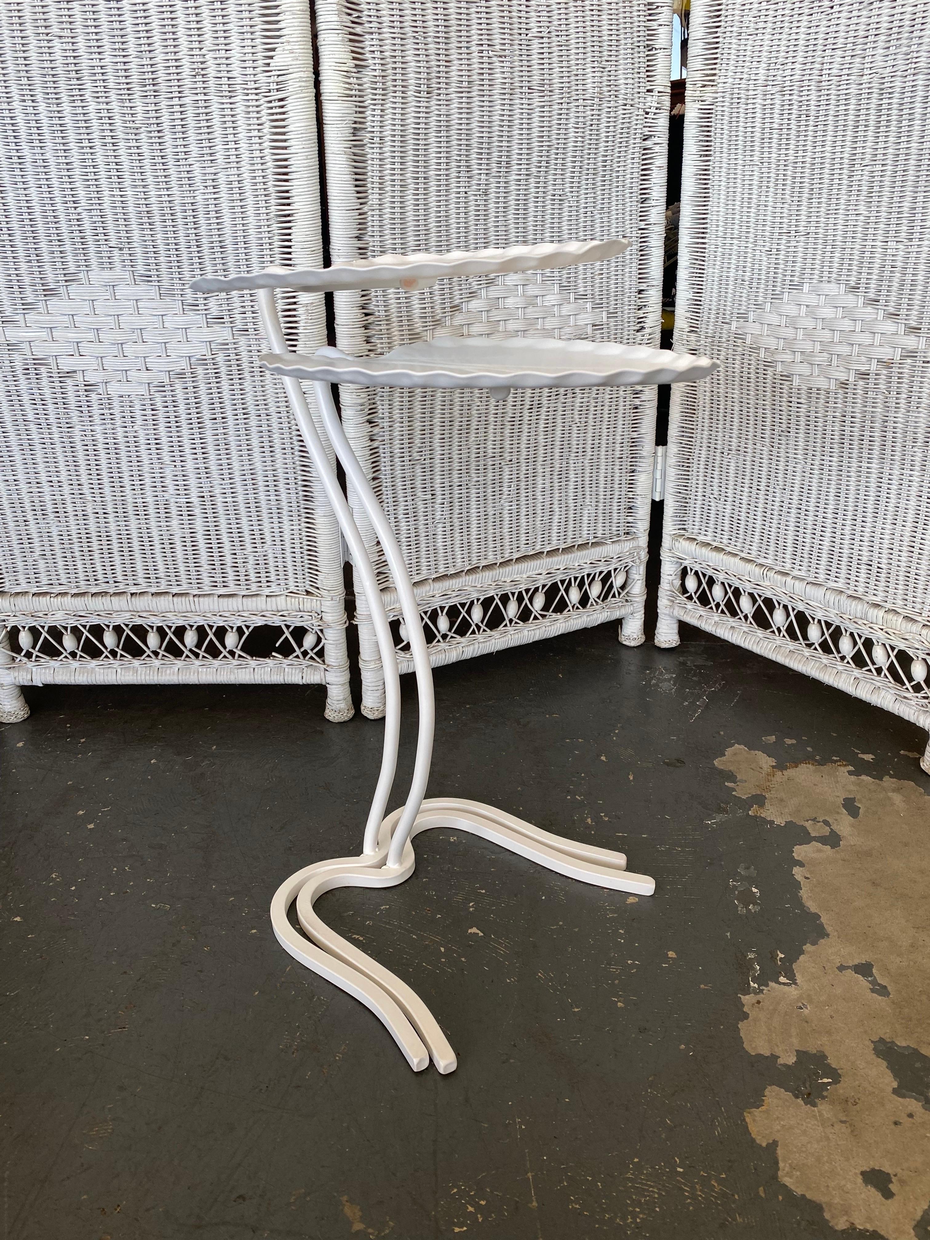 For sale we have a beautiful set of 2 John Salterini lily pad or leaf shaped nesting tables in white. 

Both tables were professionally powder coated and are in pristine condition minus a few minor dents. See pictures for details.

Dimensions of the