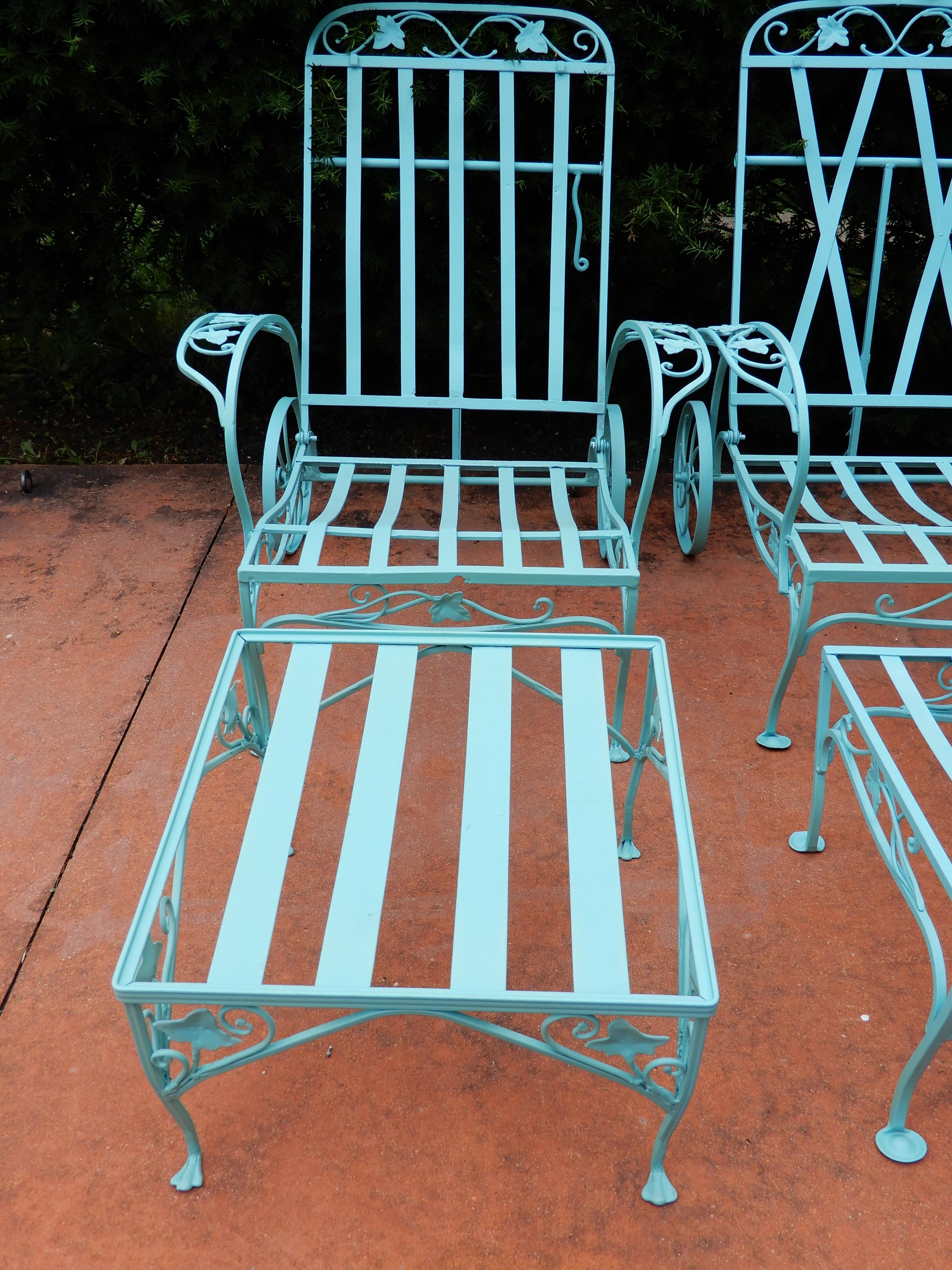 A vintage assembled pair of Salterini 2 piece chaise lounges. They have just be powder coated in a soft green / blue, most reminiscent of an original blue used by Salterini. When cushions are placed on the chairs the differences in the backs are not