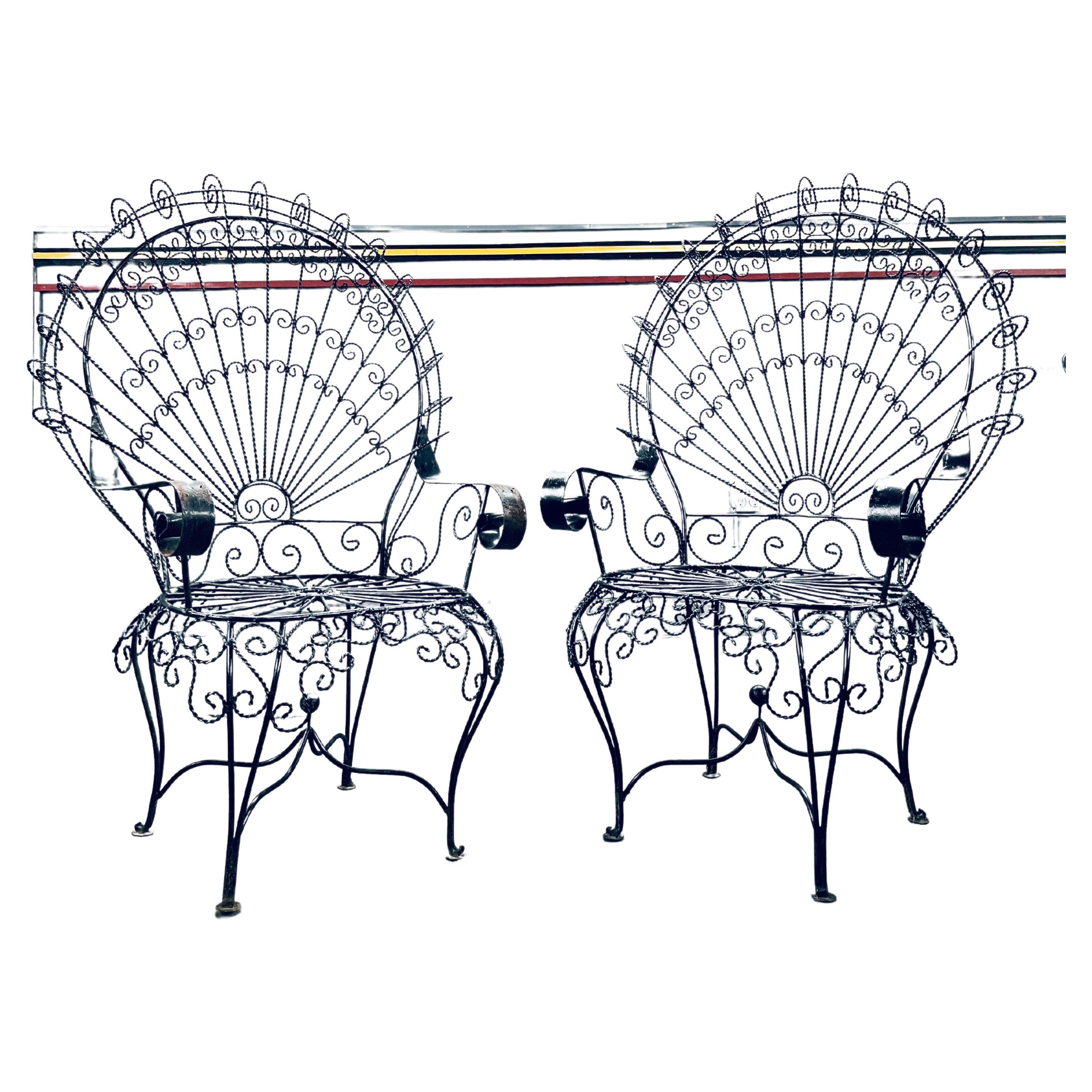 Vintage Salterini Peacock Chair -A Pair

Signature High Back Chairs Generously proportioned with wide seating and reaching 4 feet tall. Excellent scrolled detail work of twisted iron free from breaks. These chairs can be painted or sandblasted and