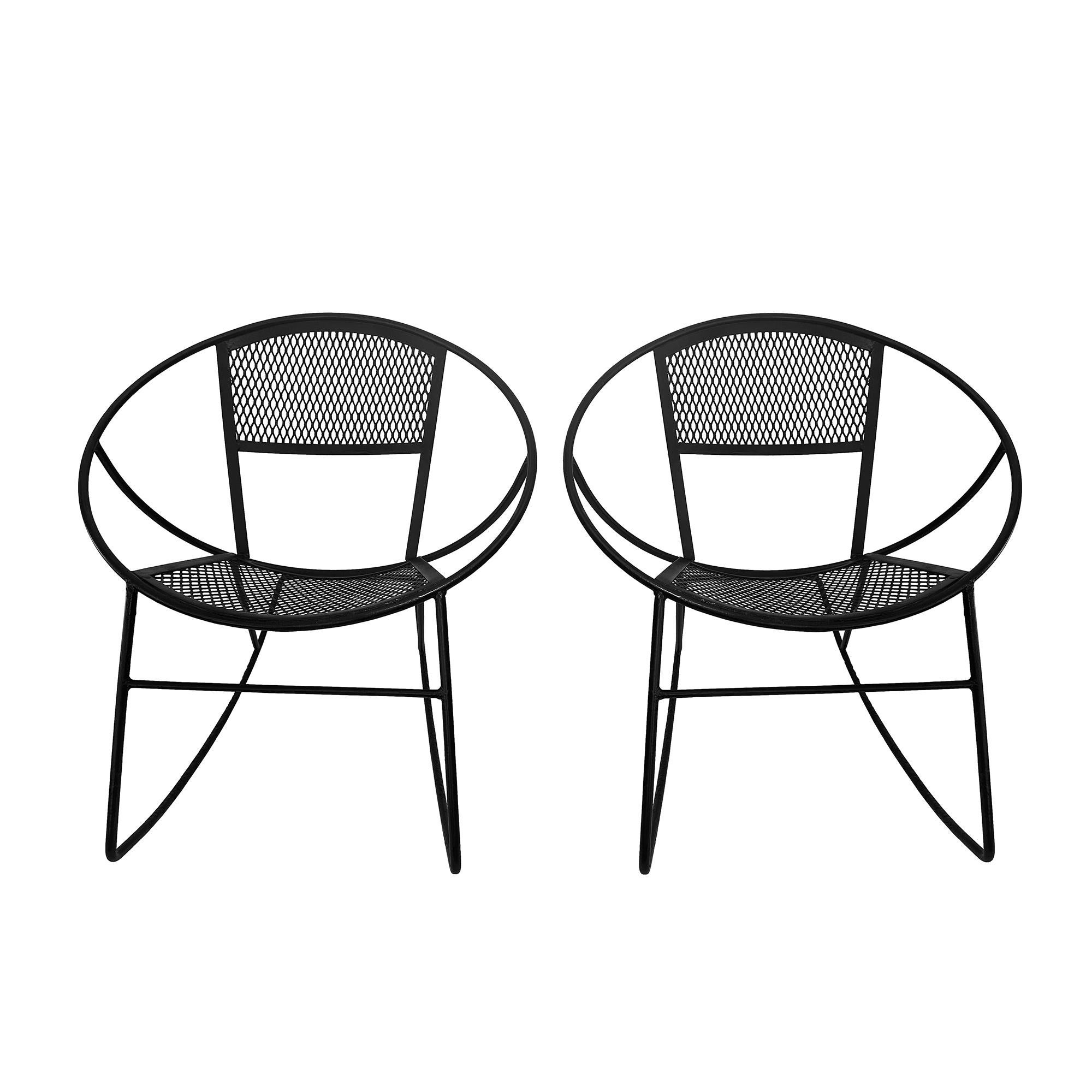 These vintage Salterini Radar Rockers are mid-century modern space-age rocking chairs that add a touch of retro charm to any indoor or outdoor space. Made of painted black wrought iron, these sleek and stylish chairs stand at 28.5 inches tall with a