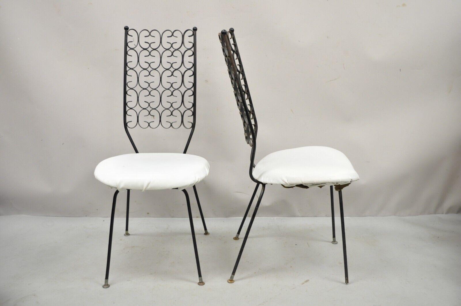 Vintage Salterini Umanoff Style Iron Scroll Dining Side Chairs - a Pair. Item features wrought Iron frame, scroll design back, great style and form. Circa mid 20th century. Measurements: 39