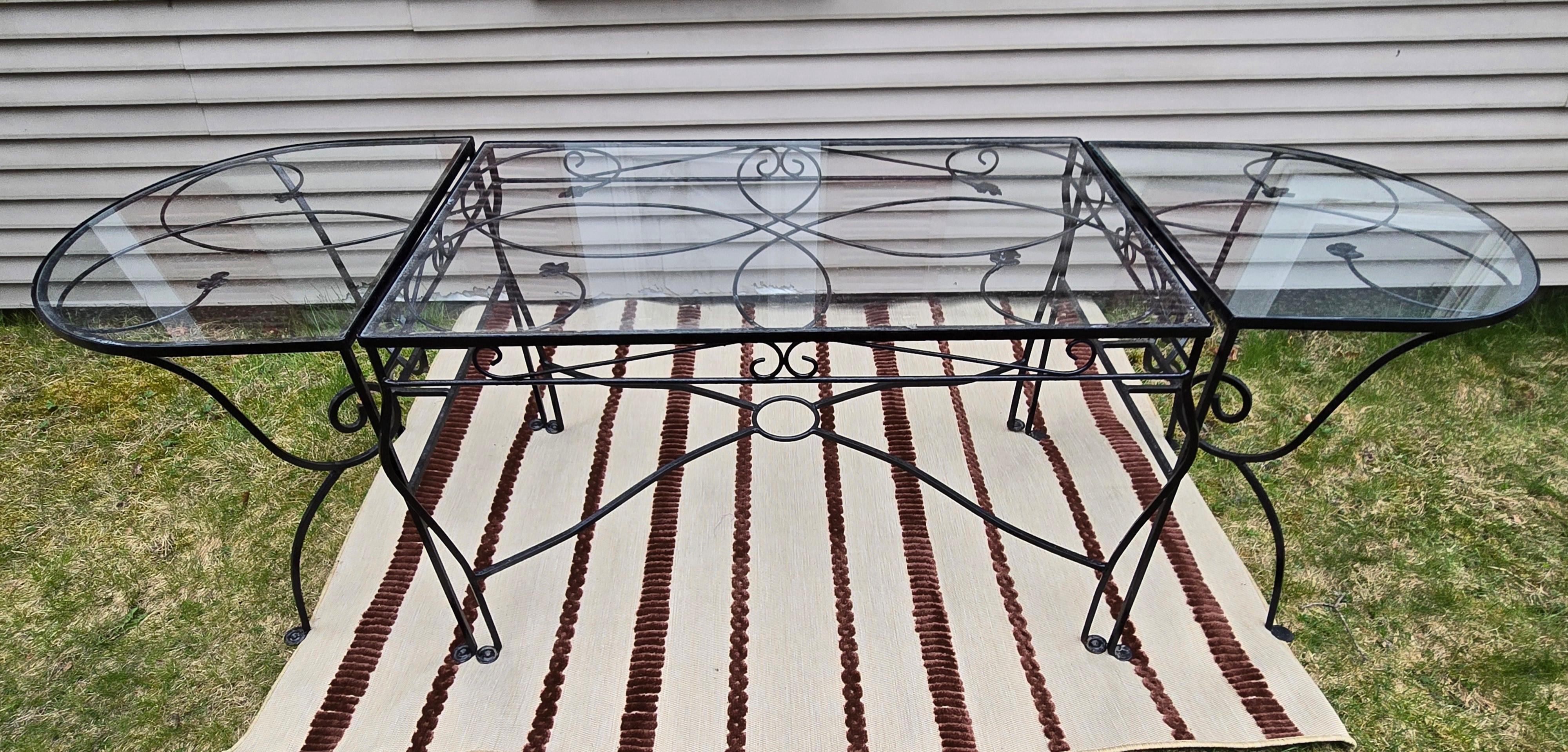 Take a look at this vintage three-piece wrought iron patio furniture set by Salterini, that is perfect for outdoor lounging and entertaining. The 3 tables create an generously sized oval shaped table providing 96 inches in length of and 32 inches in