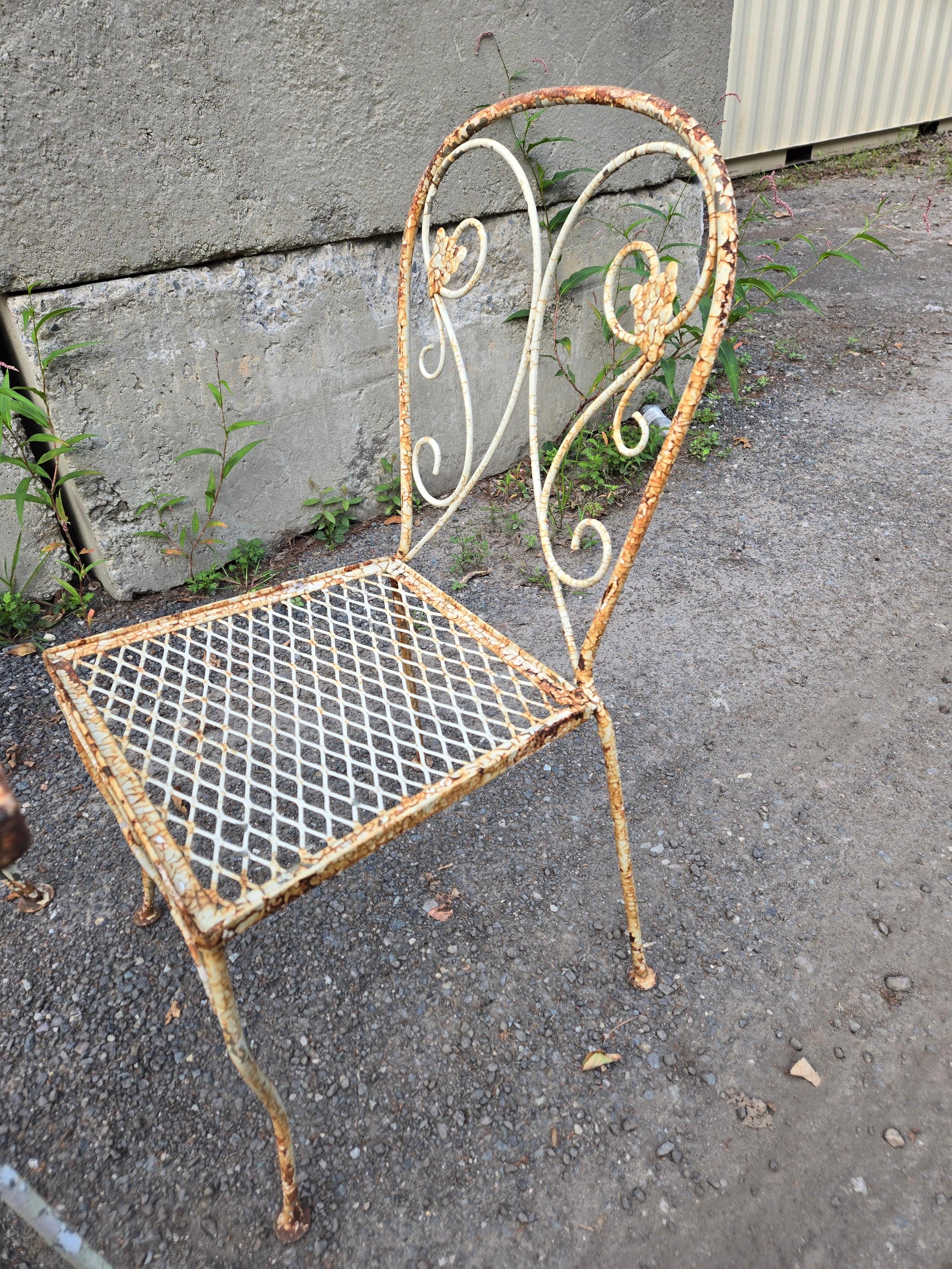 This vintage wrought iron patio furniture set is perfect for any mid-century modern enthusiast. The seven-piece set includes a 60-inch long table and six chairs, all made from durable wrought iron, and metal materials. The tabletop is white in color