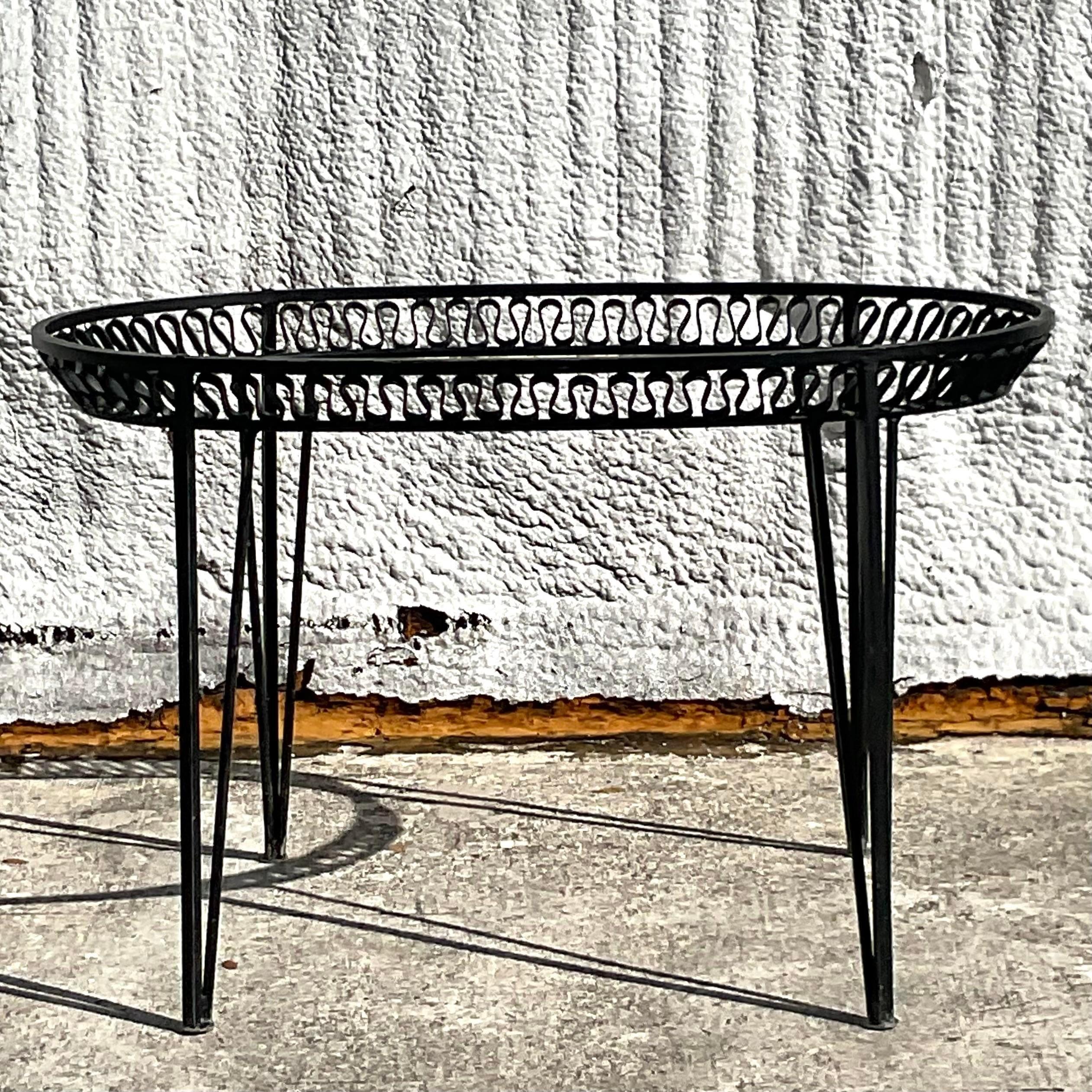 A fabulous vintage Coastal dining table pedestal. Made by the iconic Salterini. Unmarked. The coveted ribbon design on a wrought iron frame. Just add your glass! Acquired from a Palm Beach estate.