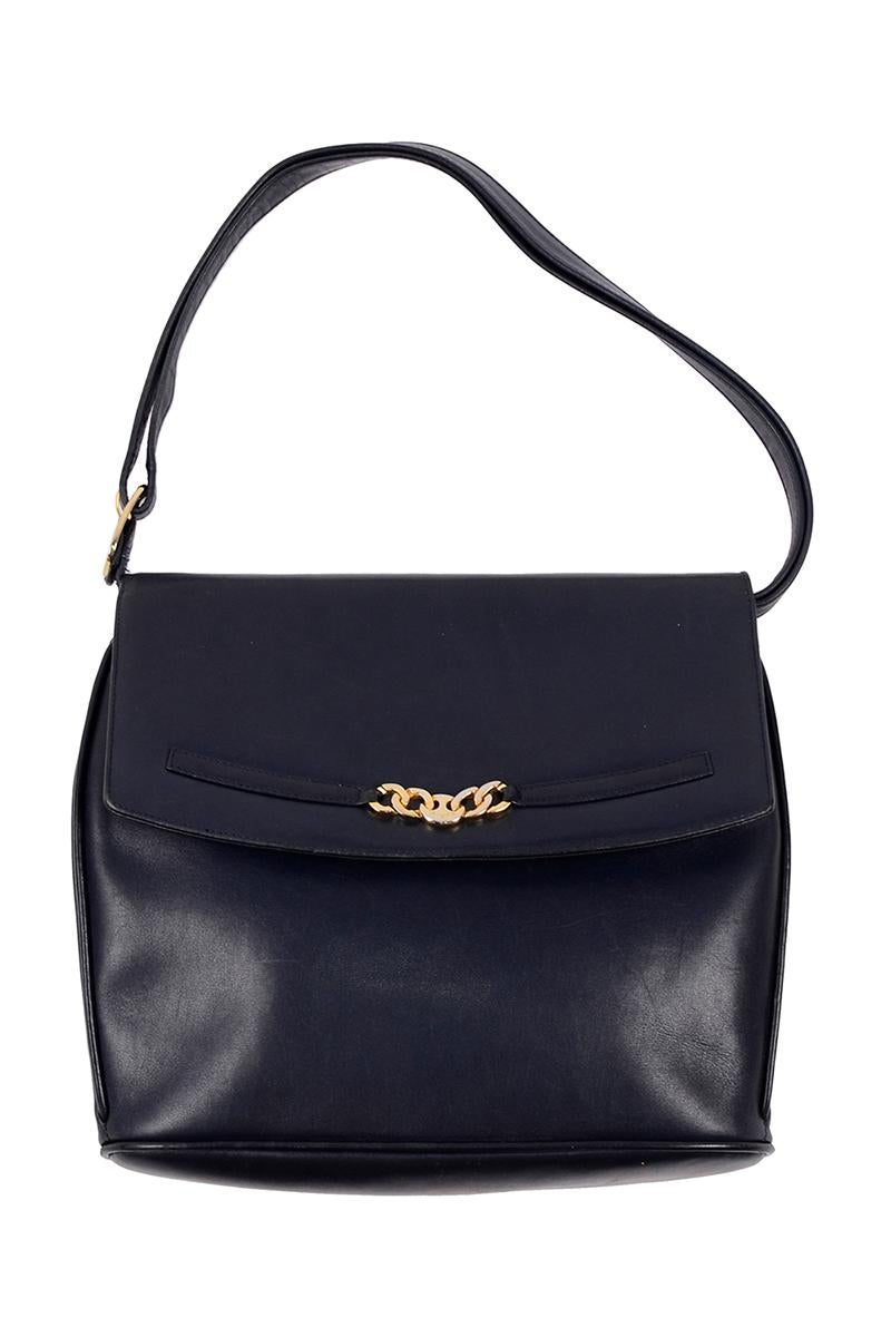 This is a nice navy blue leather Ferragamo vintage handbag with a shoulder strap. The front of the bag has Ferragamo's signature chain link detail with a metal nameplate in the center. The bag is stamped Salvatore Ferragamo with all serial numbers