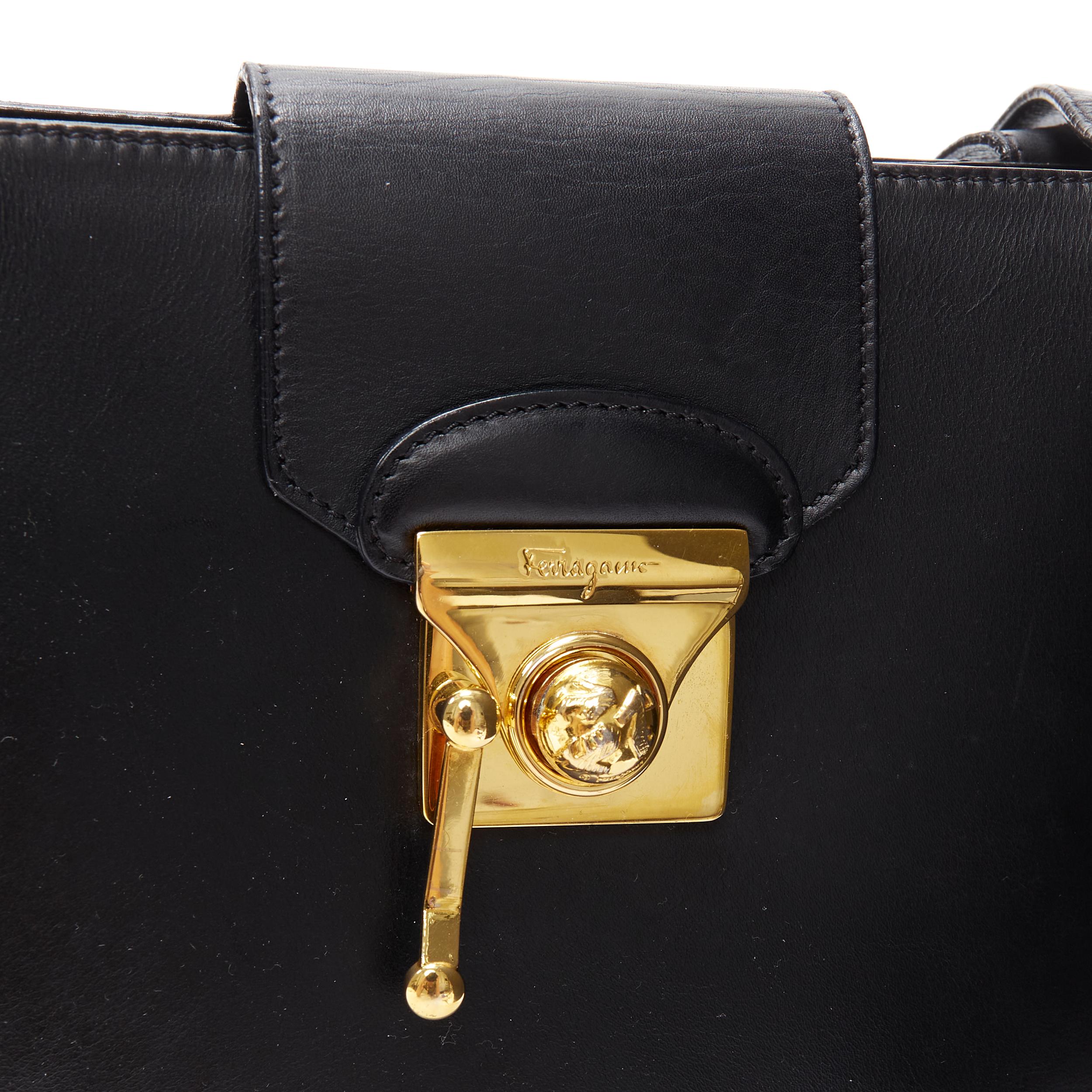 Women's vintage SALVATORE FERRAGAMO black gold round stud clasp lock shoulder bag For Sale