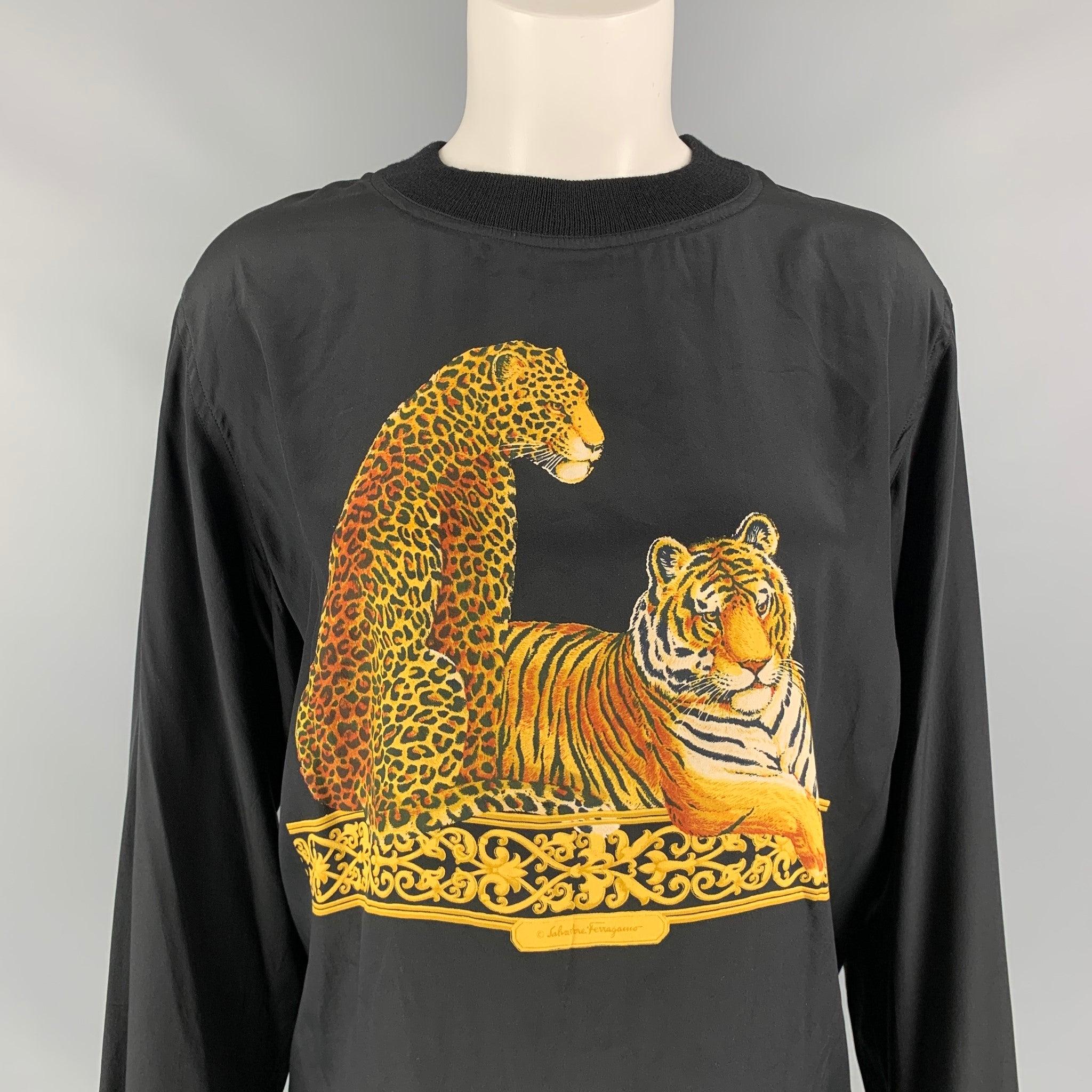 Vintage SALVATORE FERRAGAMO blouse comes in a black & beige tiger print silk featuring a ribbed hem and a crew-neck. Made in Italy.
Very Good
Pre-Owned Condition. 

Marked:   M 

Measurements: 
 
Shoulder: 17 inches  Bust:
41 inches Sleeve: 23