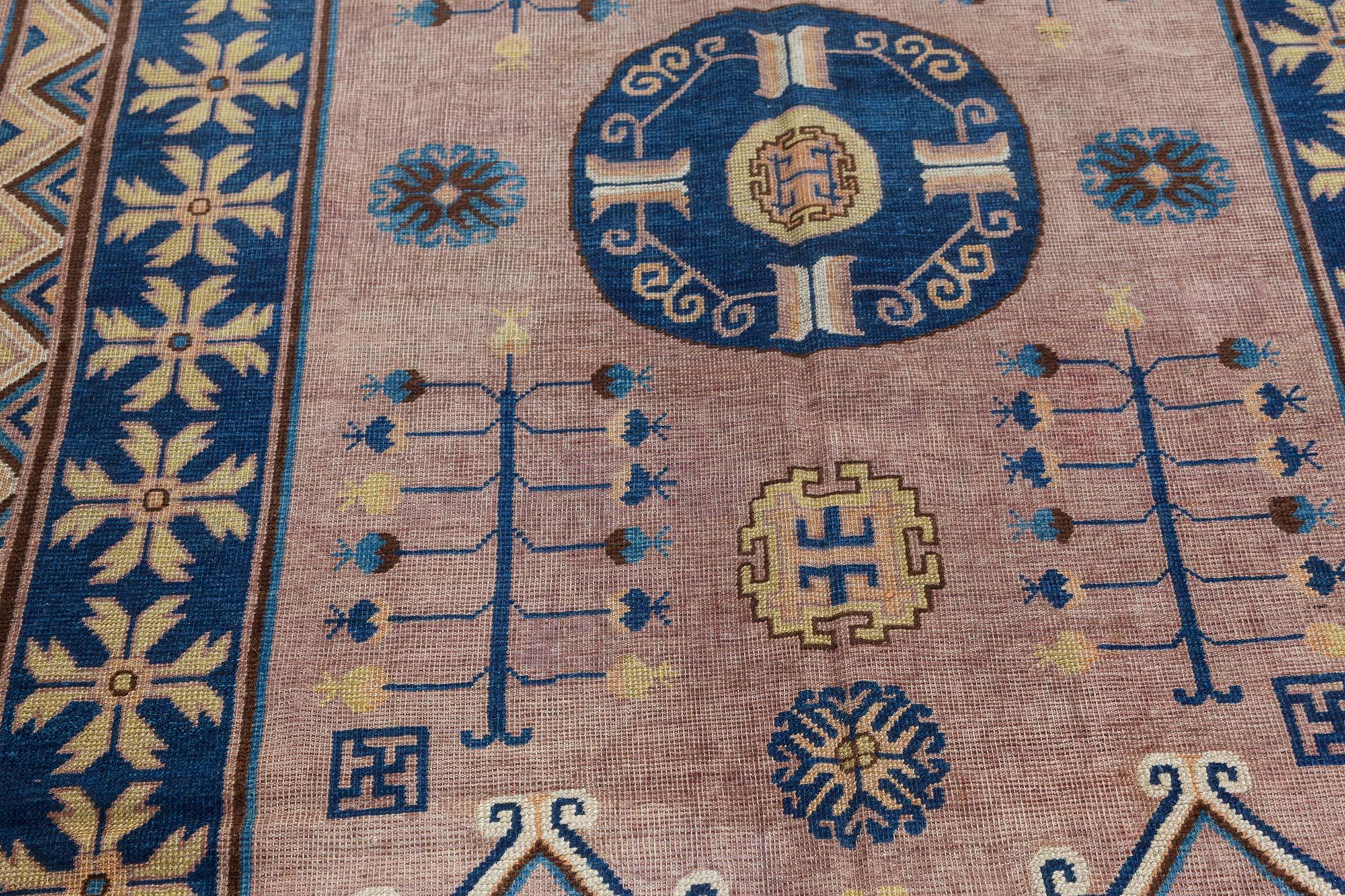 Vintage Samarkand 'Khotan' brown, blue handmade wool rug.
Size: 4'7