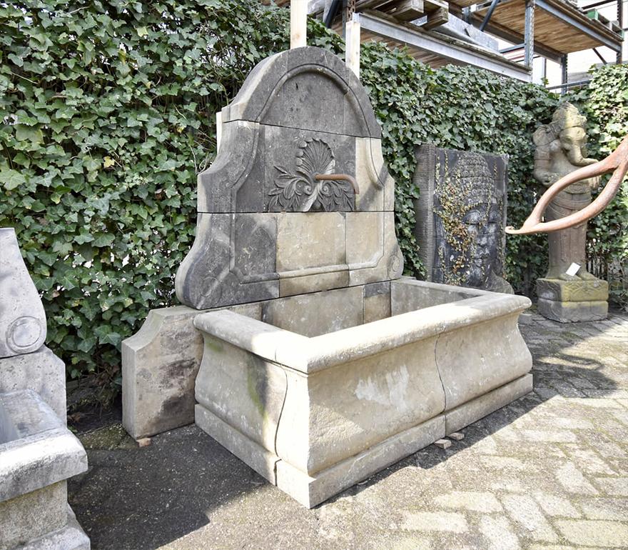 Nice vintage sandstone wall fountain to complete
the garden.