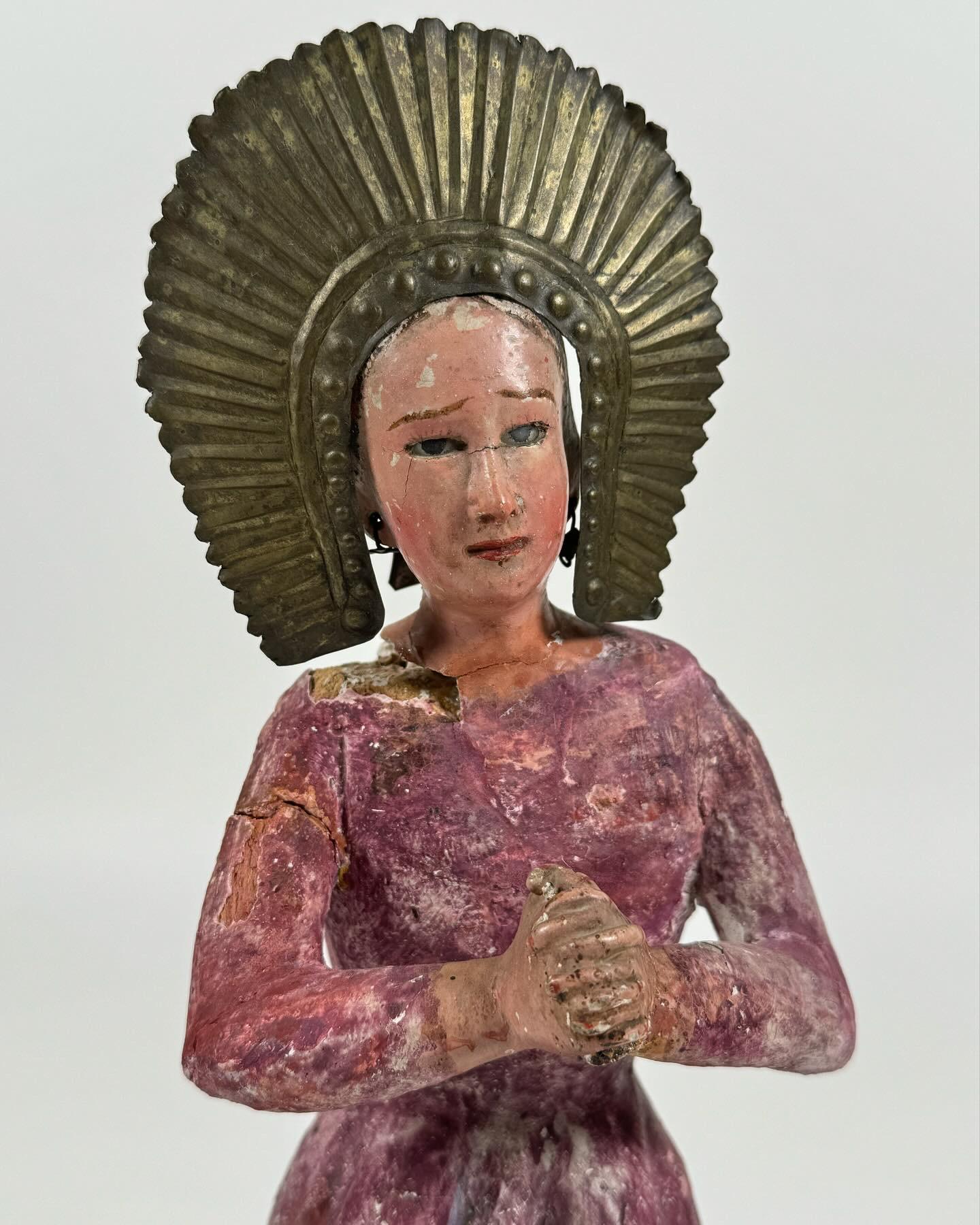 Vintage Santos / Saint most likely of Mexican origin, age most likely 19th Century judging by the patina. Hand carved and painted wood figure with metal halo and earrings along with glass eyes. Much patina to the sculpture which many find appealing