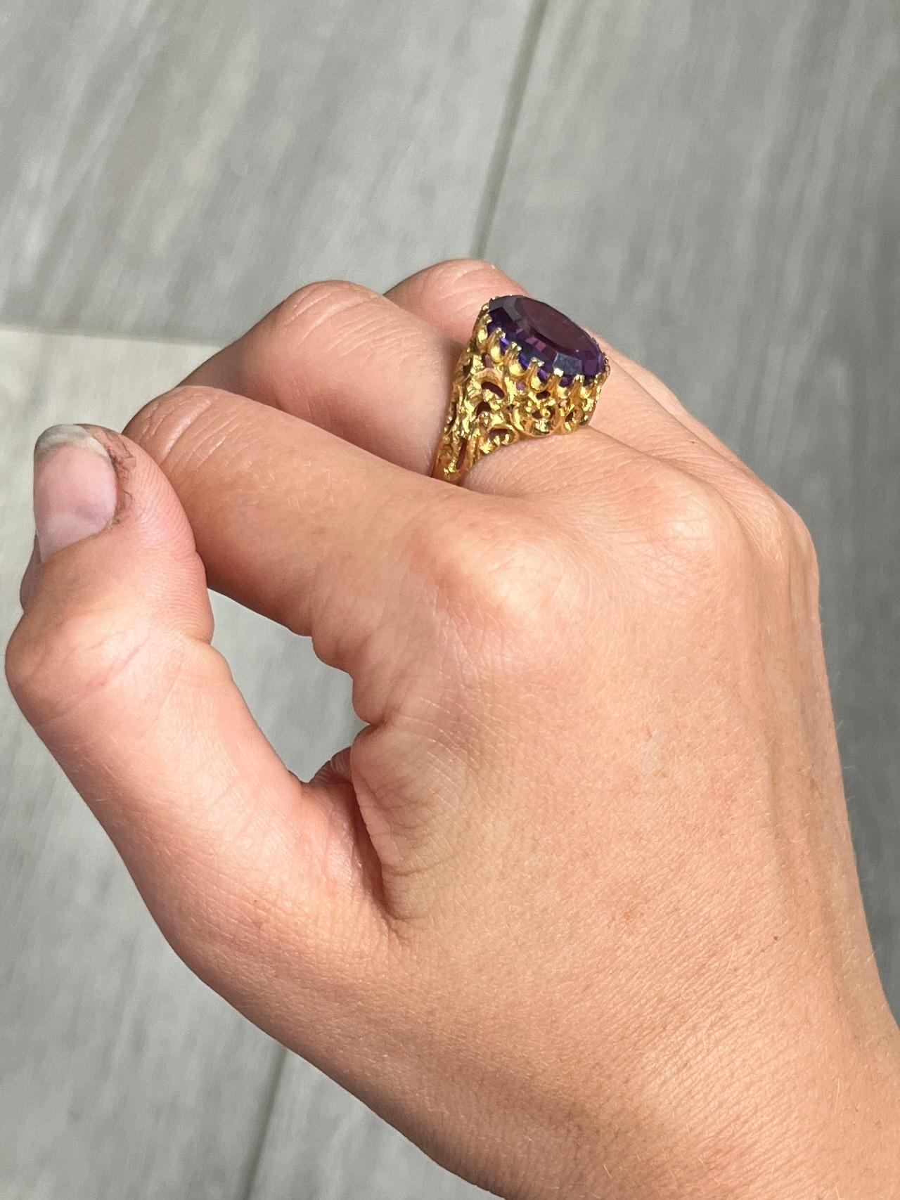 This gorgeous ring holds a stunning purple sapphire. The colour of the stone has a violet glow and is perfectly complimented by the bright 18carat yellow gold. 

Ring Size: N 1/2 or 7 
Stone Dimensions: 14x12mm
Height Off Finger: 8mm

Weight: 7.5g 