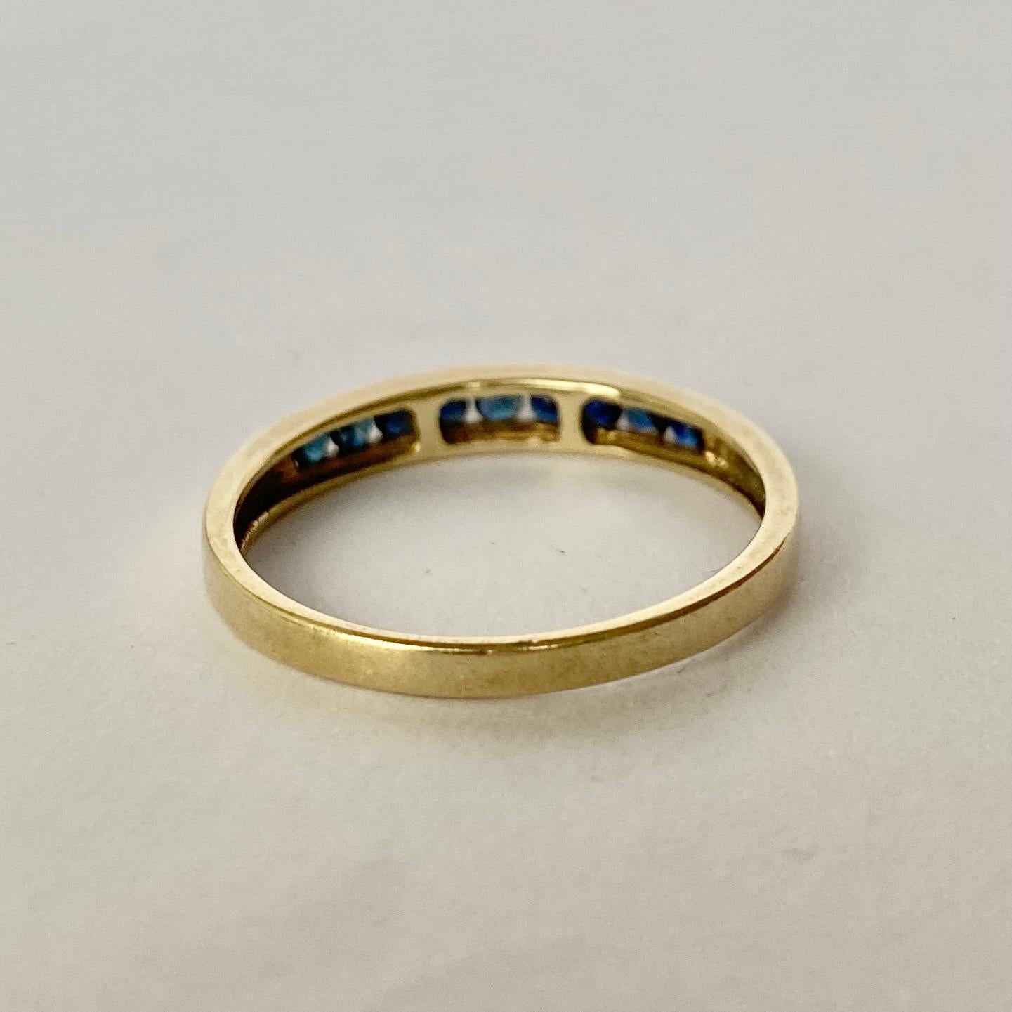 The sapphire set within this 9ct gold band are round cut and total approx 20pts. They have a great shine to them and are a gorgeous inky blue colour. 

Ring Size: T or 9 1/2 
Band Width: 3.5mm 

Weight: 1.88g