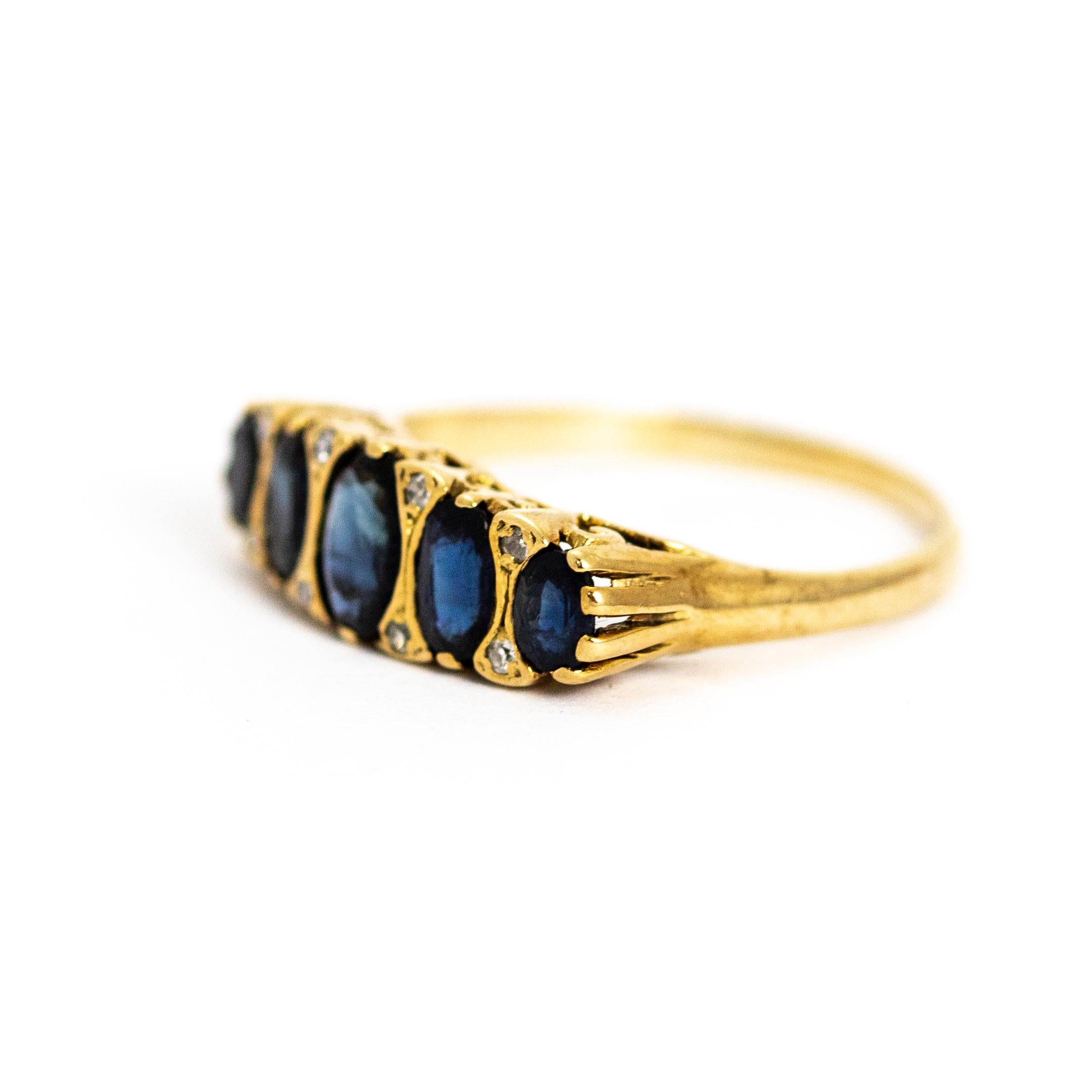 What a stunner! The deep blue sapphires have such a sparkle and the small diamonds in between them make this ring extra sparkly! Five graduated sapphires sit proud with eight diamonds on a decorative 9ct gold setting and band. Made in London