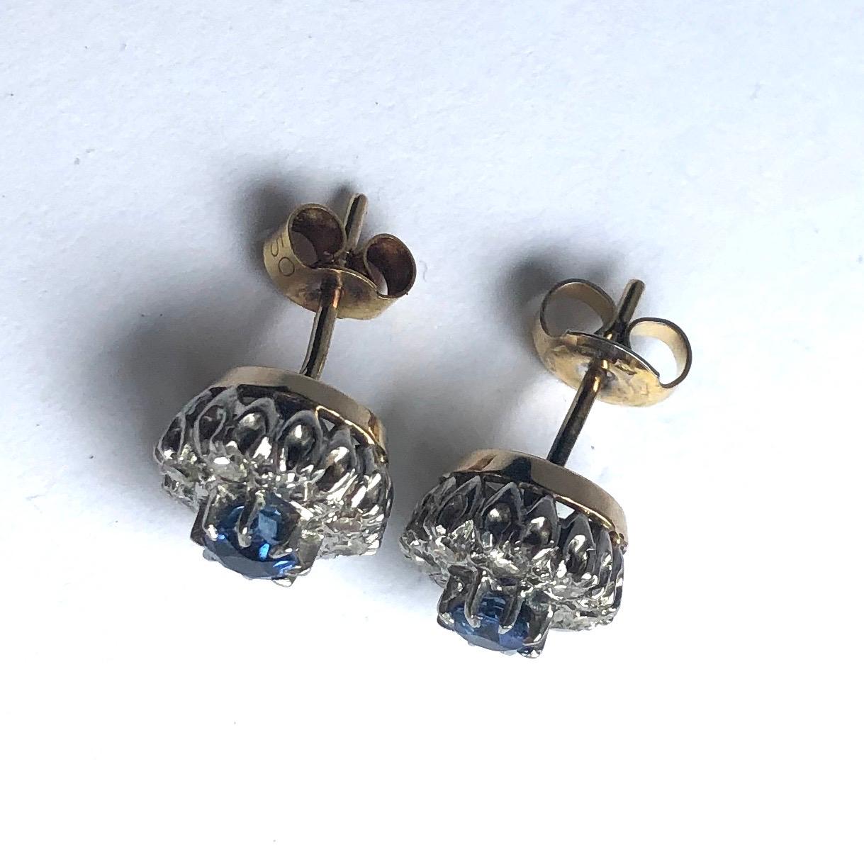 The pale yet bright sapphires at the centre of these clusters measure 30pts each and are surrounded by diamonds. The diamonds total 40pts per earring. The stones are set in platinum and the rest of the earrings are modelled in 18ct gold. 

Cluster