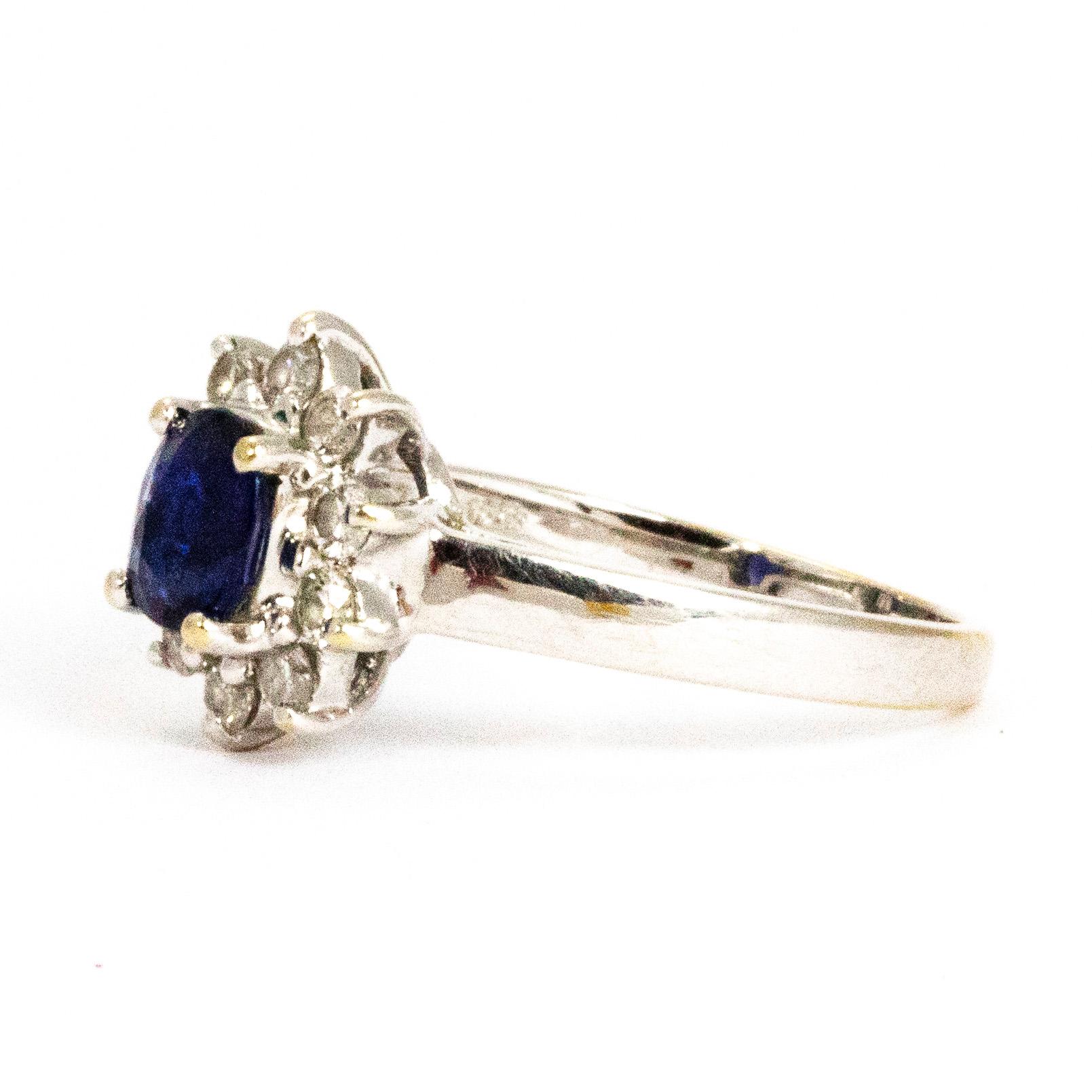 The sapphire at the centre of this beauty is an exquisite deep blue colour which is paired together perfectly with the halo of bright brilliant cut white diamonds that encircle it. The sapphire measures approximately 90pts and the diamonds measure a