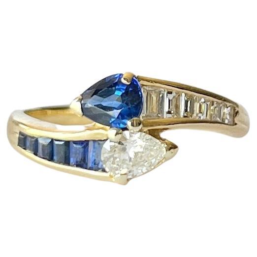 Vintage Sapphire and Diamond 18 Carat Gold Cross Over Ring For Sale