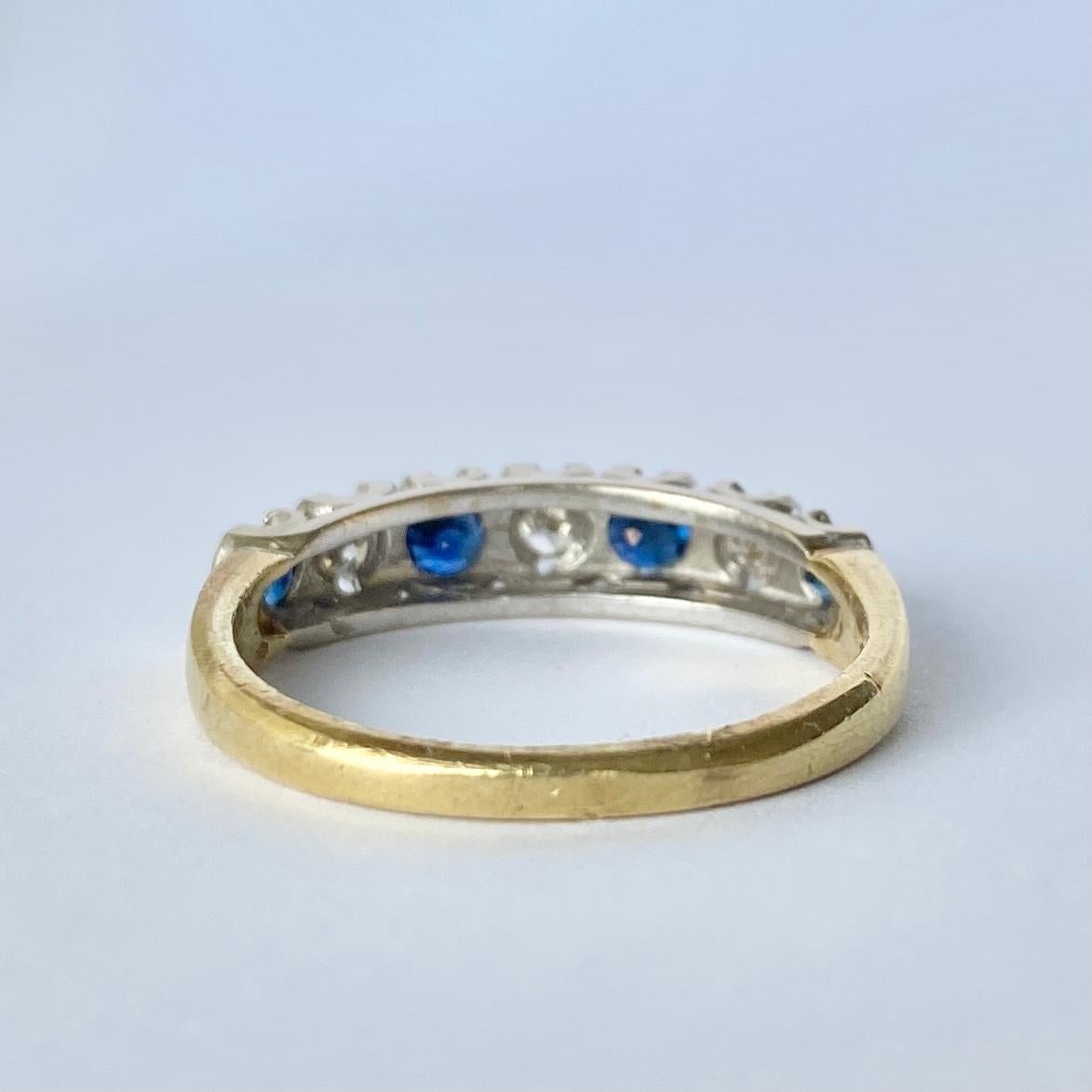Set within this 18ct gold band there are four deep blue sapphires and three sparkling diamonds. The sapphires total 40pts and the diamond total is 30pts. Fully hallmarked London 1978.

Ring Size: P or 7 3/4 
Band Width: 5mm

Weight: 3.6g 