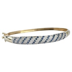 Armreif aus 9 Karat Gold mit Saphiren und Diamanten