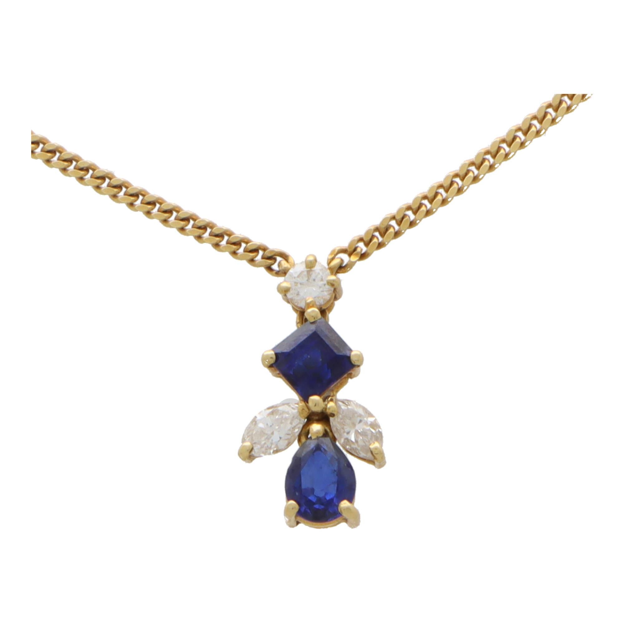 
A beautiful sapphire and diamond abstract pendant necklace set in 18k yellow gold.

The pendant is firstly composed of a round brilliant cut diamond which suspends a square cut sapphire and pear cut sapphire. The sapphires are securely claw set and