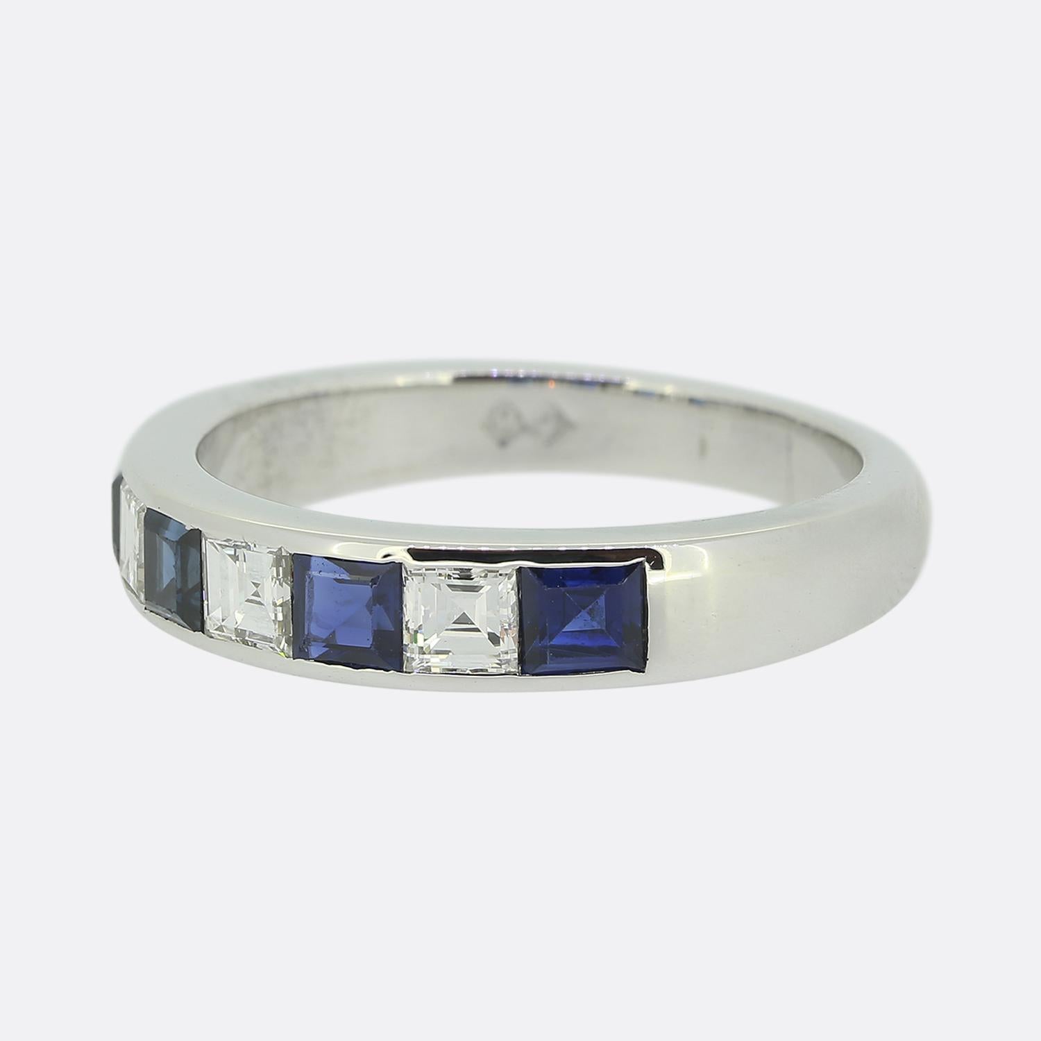 Here we have a smart and sophisticated 18ct white gold band ring. The design features alternating square-cut deep blue sapphires and bright white carré cut diamonds, creating a striking contrast. Each stone is set flush within the band providing a