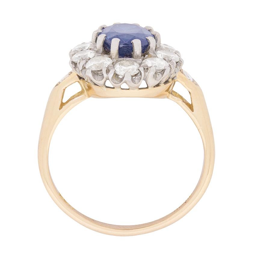 In the centre of this vintage ring is a 1.50 carat sapphire. It is a stunning blue in colour and has been claw set perfectly. To enhance the colour and add some sparkle to this ring, there is a beautiful halo of diamonds which total 1.00 carat. They