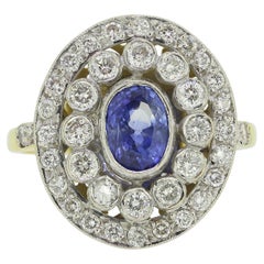 Anillo vintage de zafiro y diamantes en racimo