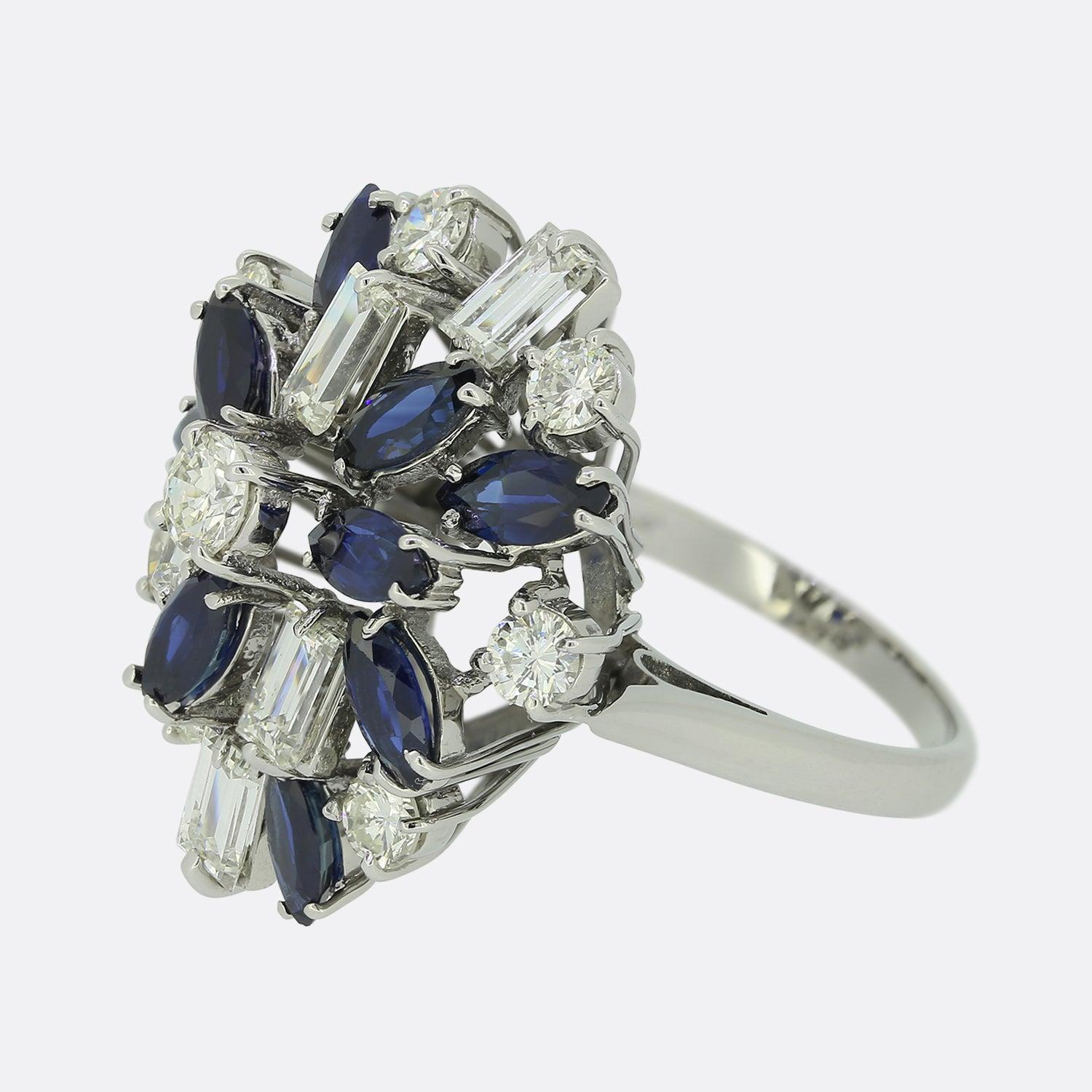 Here we have a delightful vintage sapphire and diamond cocktail ring. The ring features a sporadic array of gemstones including marquise shaped sapphires possessing a wonderfully rich royal blue colour tone. These natural stones are complimented by