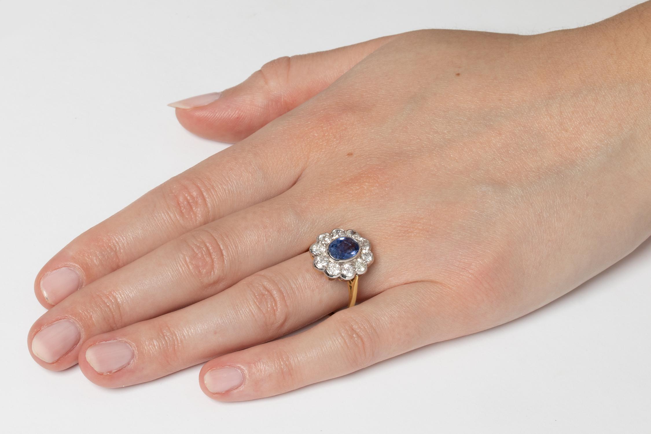 Oval Cut Vintage Sapphire and Diamond Halo Ring, circa 1960s For Sale