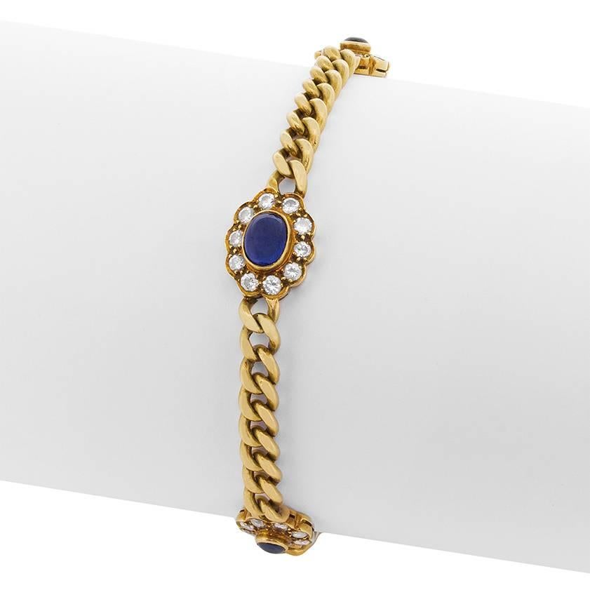 This retro and vintage bracelet features a total of 2.00 carat's worth of Sapphires as the main feature. They are a wonderful blue and are cabochon cut stones, making them really stand out. Each of the three stones is beautifully highlighted by a