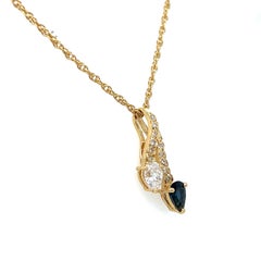 Collier vintage en or jaune 14 carats, serti de saphirs et de diamants.