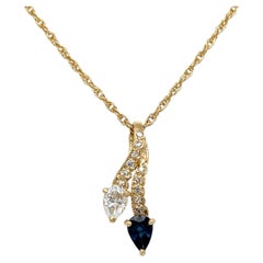 Collar vintage de zafiros y diamantes en oro amarillo de 14K.