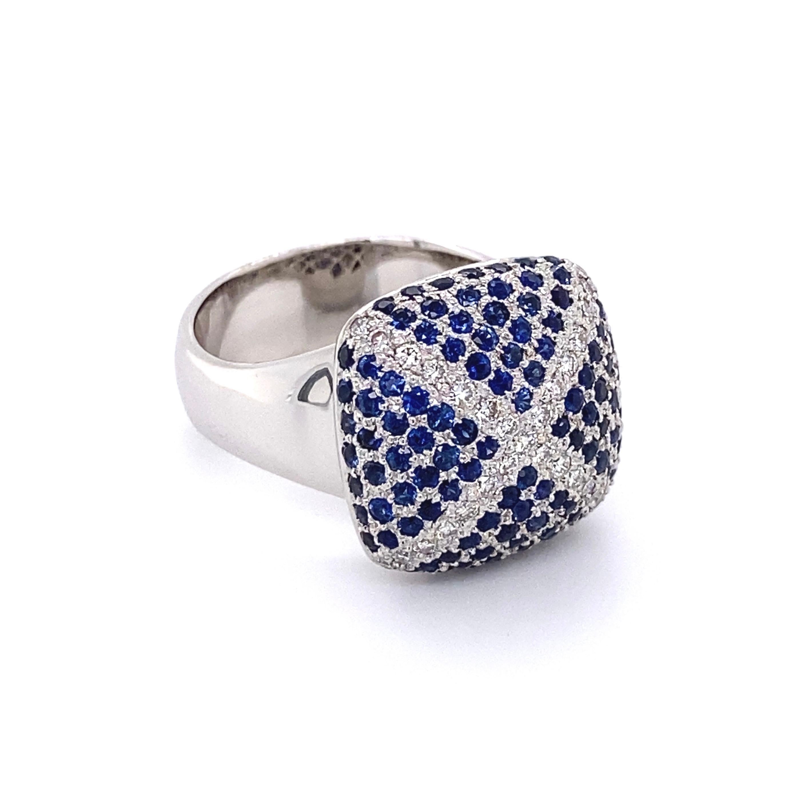 Simply Beautiful! Finely Detailed Sapphire and Diamond Pillow Cushion Gold Ring. Encrusted with Blue Sapphires, approx. 1.79tcw and Diamonds, approx. 0.38tcw. Hand crafted in 18K White Gold. Measuring approx. 1.12” l x 0.87” w x 0.66” h. Ring size: