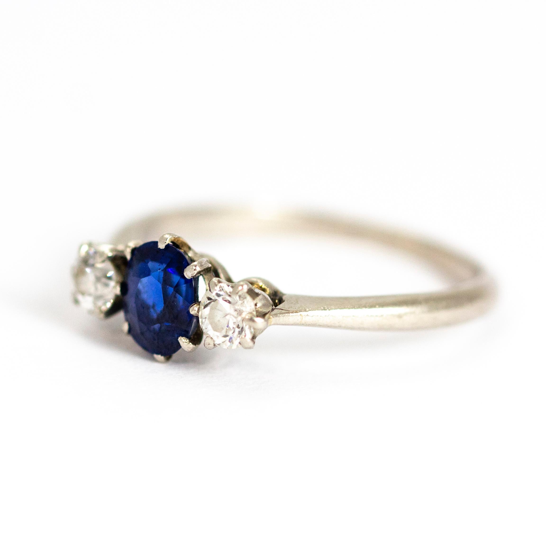 The oval sapphire in this ring has a wonderful blue glow to it and is sat between two smaller round cut diamonds. Classic and timeless in style, this three stone beauty could be worn alone or stacked. Modelled in platinum. 

Ring Size: J 1/2 or 5
