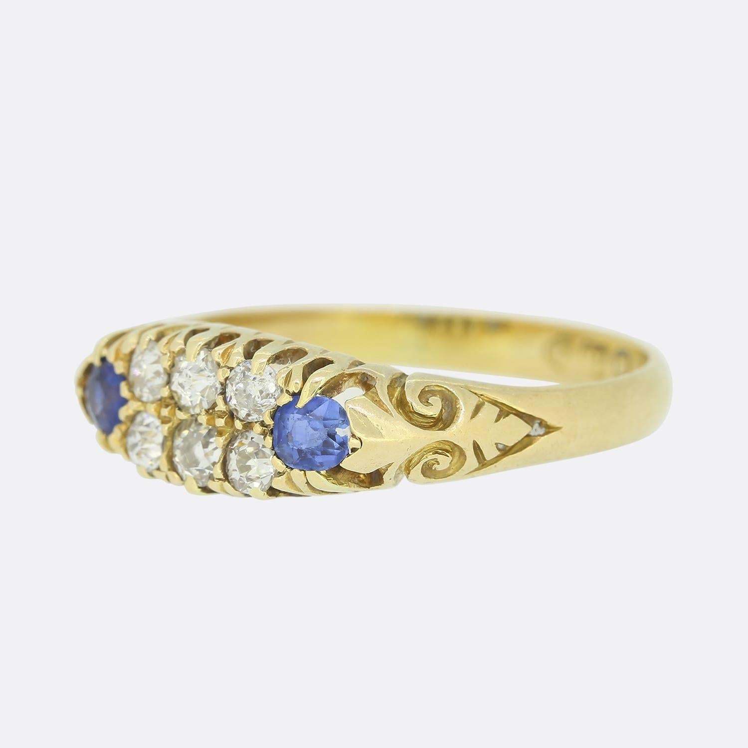 This vintage 18ct yellow gold ring plays host to 6 old cut diamonds and 2 round sapphires. The shank of the ring is beautifully crafted with an elegant pattern.

Condition: Used (Very Good)
Weight: 3.3 grams
Size: P
Sapphire Dimensions:  2