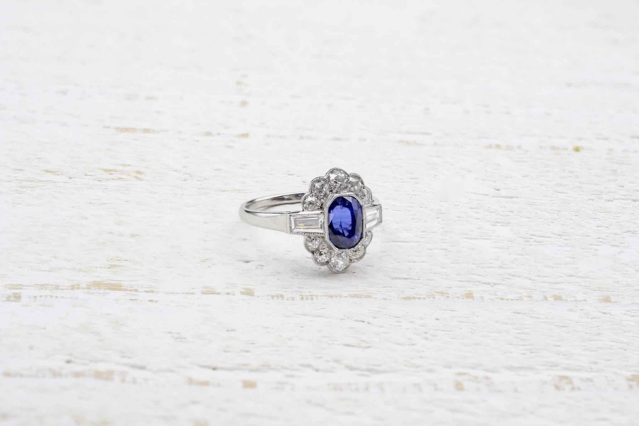Oval Cut Vintage sapphire and diamonds ring in platinum For Sale