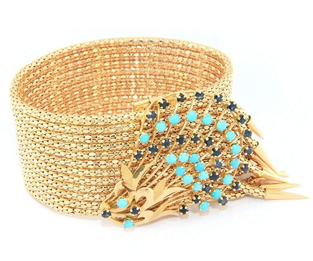 Vintage Sapphire and Turquoise Spray Multi Row Fringe Bracelet in 18K

Vintage Sapphire and Turquoise Spray Multi Row Fringe Bracelet
18K Yellow Gold
Sapphire Carat Weight: Approx. 2.60ctw
Turquoise Diameter: Approx. 3.1 MM
Bracelet Width: Approx.