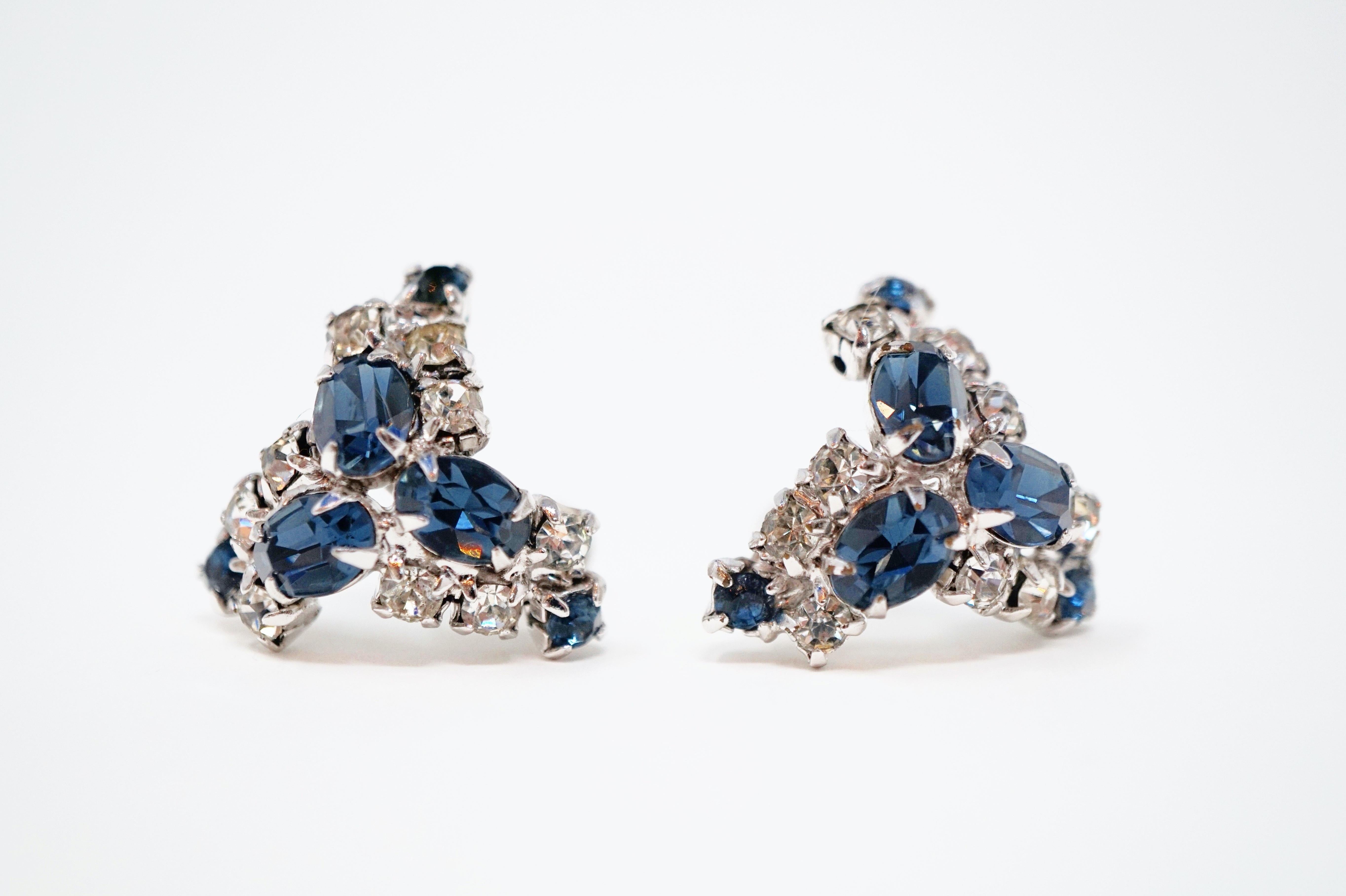 Absolutely gorgeous sparkling rhinestone earrings from the mid-century era, featuring faceted Sapphire-colored crystal rhinestones surrounded by clear crystal rhinestone pavé with silver tone hardware.

DETAILS:
- Screw back clip-on earring backs
-