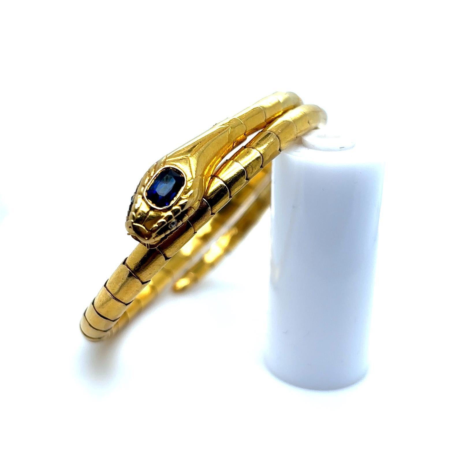 A vintage sapphire and diamond set 18 karat yellow gold snake flexible bracelet.

This charming snake bracelet, coils around the wrist of the wearer, and expands to fit any wrist size.

Excellently crafted as a realistically modelled snake and grain