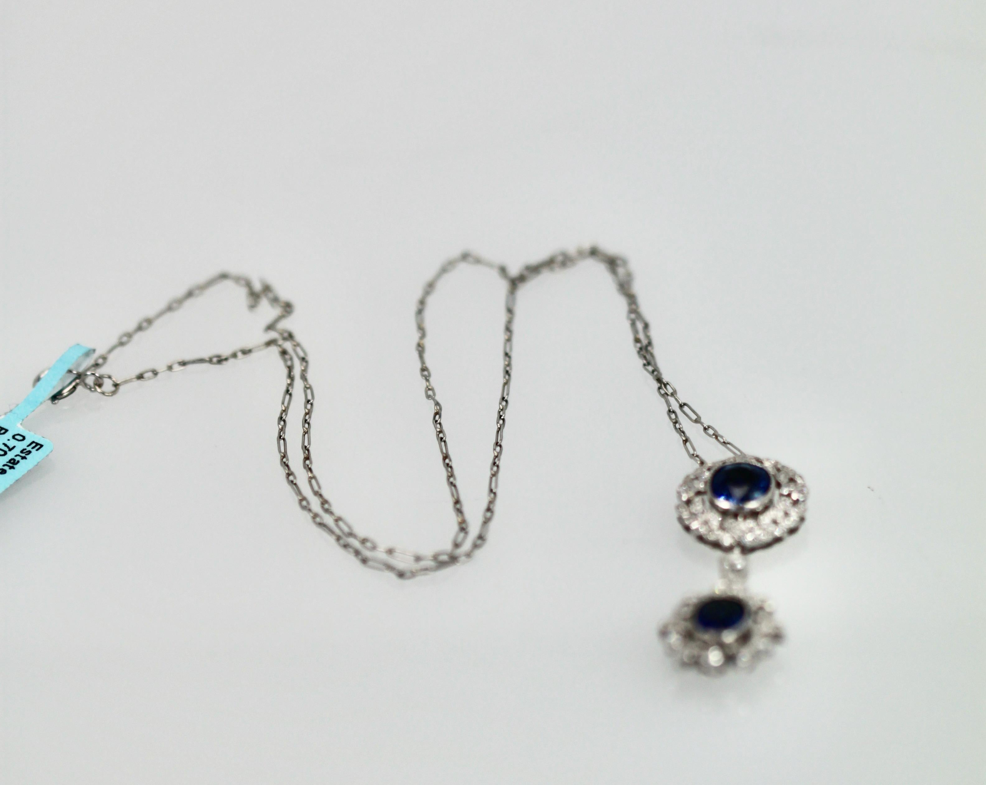 This necklace is made in 18K White Gold and features 2 beautiful Blue Sapphires. The style is modern yet bears a vintage drop necklace style. The necklace is 18