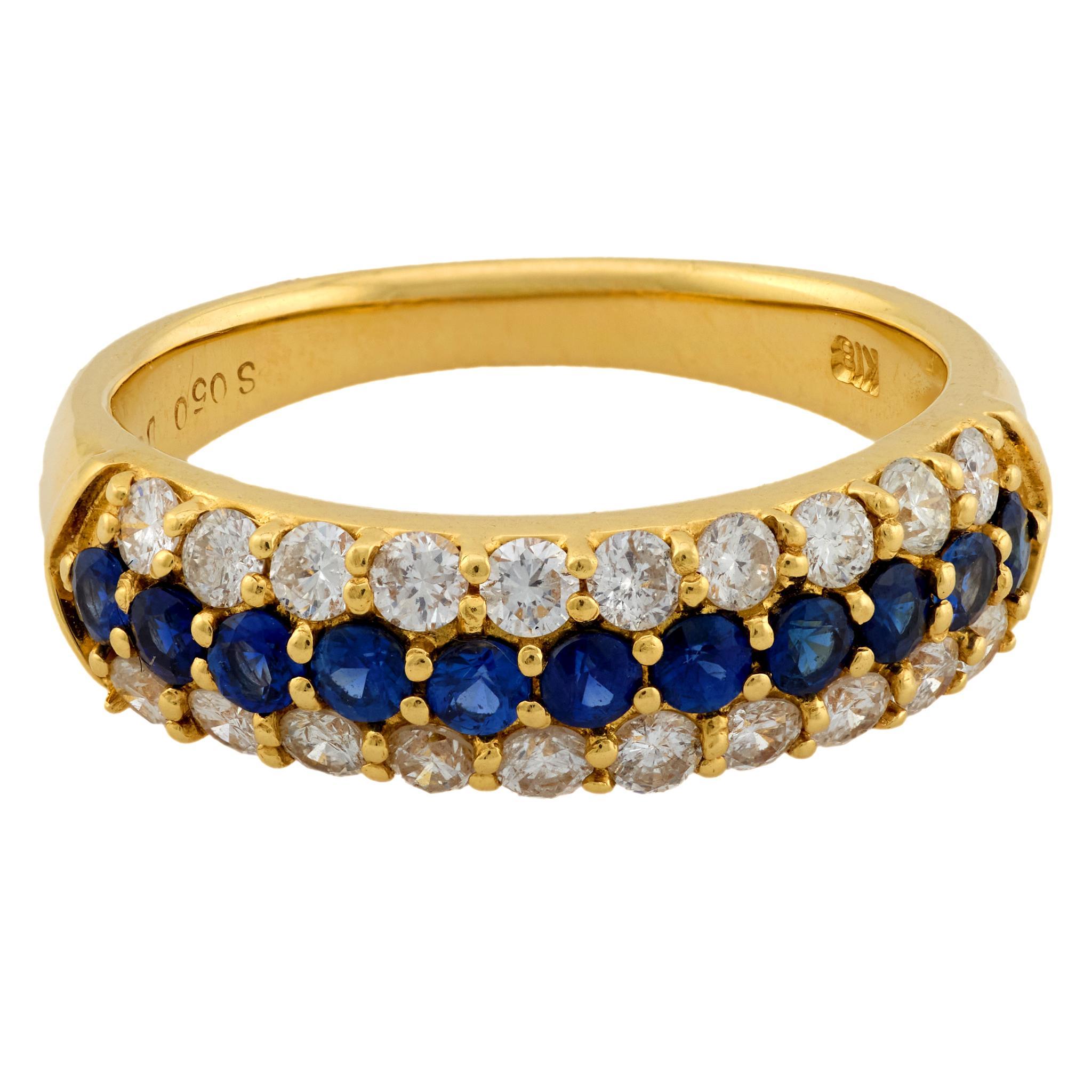 This 18k yellow gold ring features vivid round sapphires and sparkling F-G color diamonds, combining vibrant color with refined brilliance and classic style.
