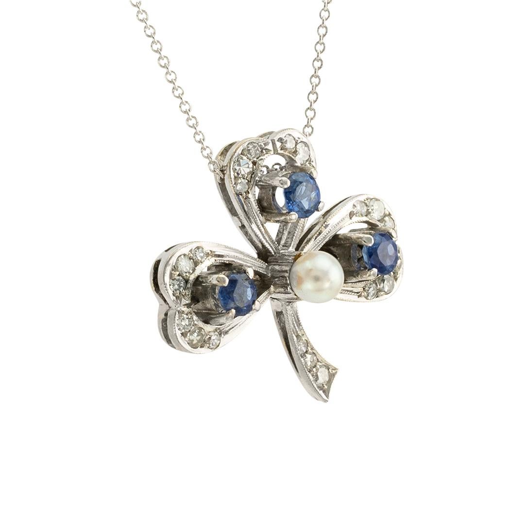 Vintage sapphire pearl and diamond white gold clover leaf slide pendant circa 1930. *

ABOUT THIS ITEM:  #P-DJ622a. Scroll down for detailed specifications.  The clover leaf design symbolizes luck and prosperity.  Moreover, the contrast between the