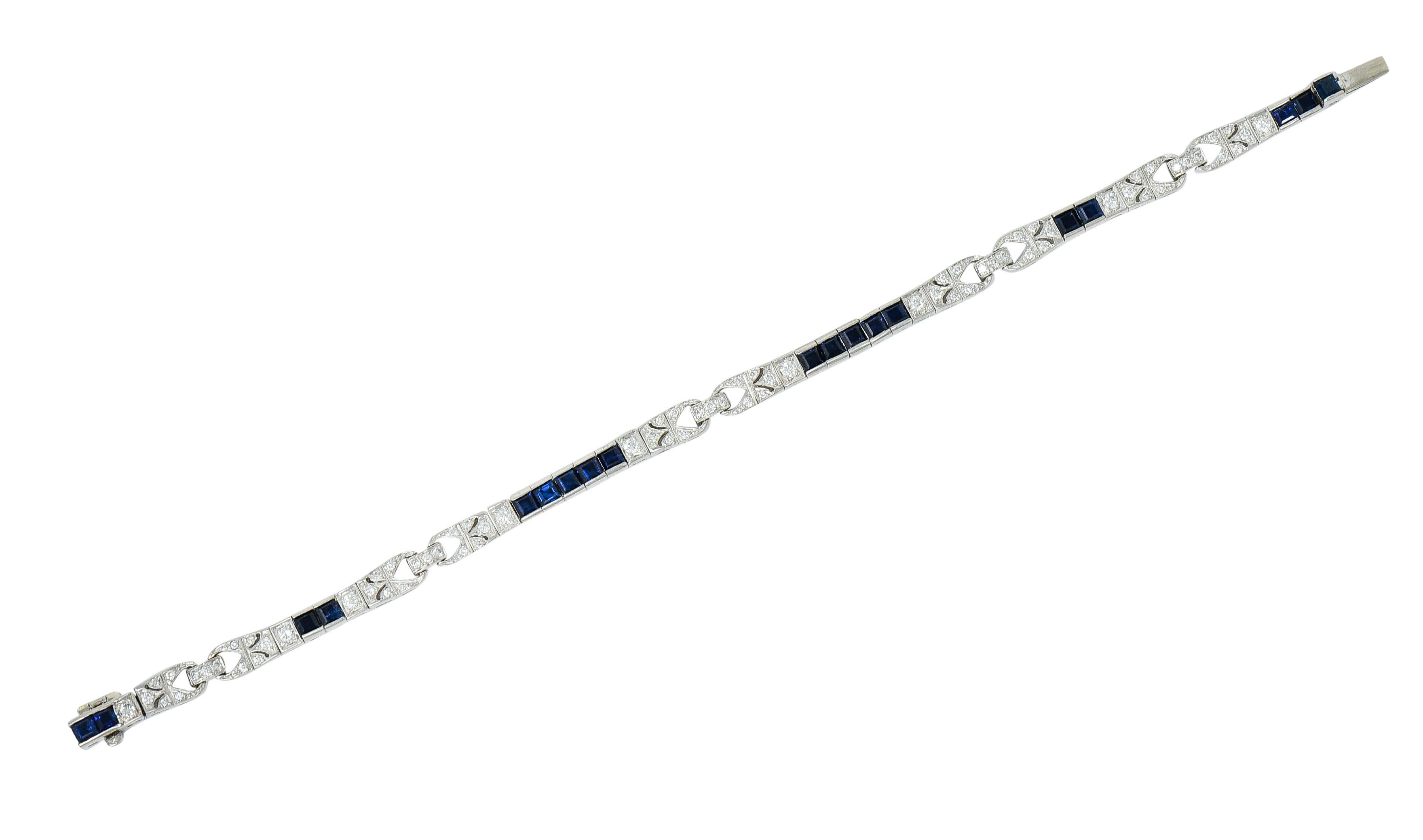 Line style bracelet is designed with a subtle buckle motif alternating with channel set sapphires

Square cut sapphires are a well-matched dark blue and weigh in total approximately 3.65 carats

Accented by round brilliant cut diamonds weighing in