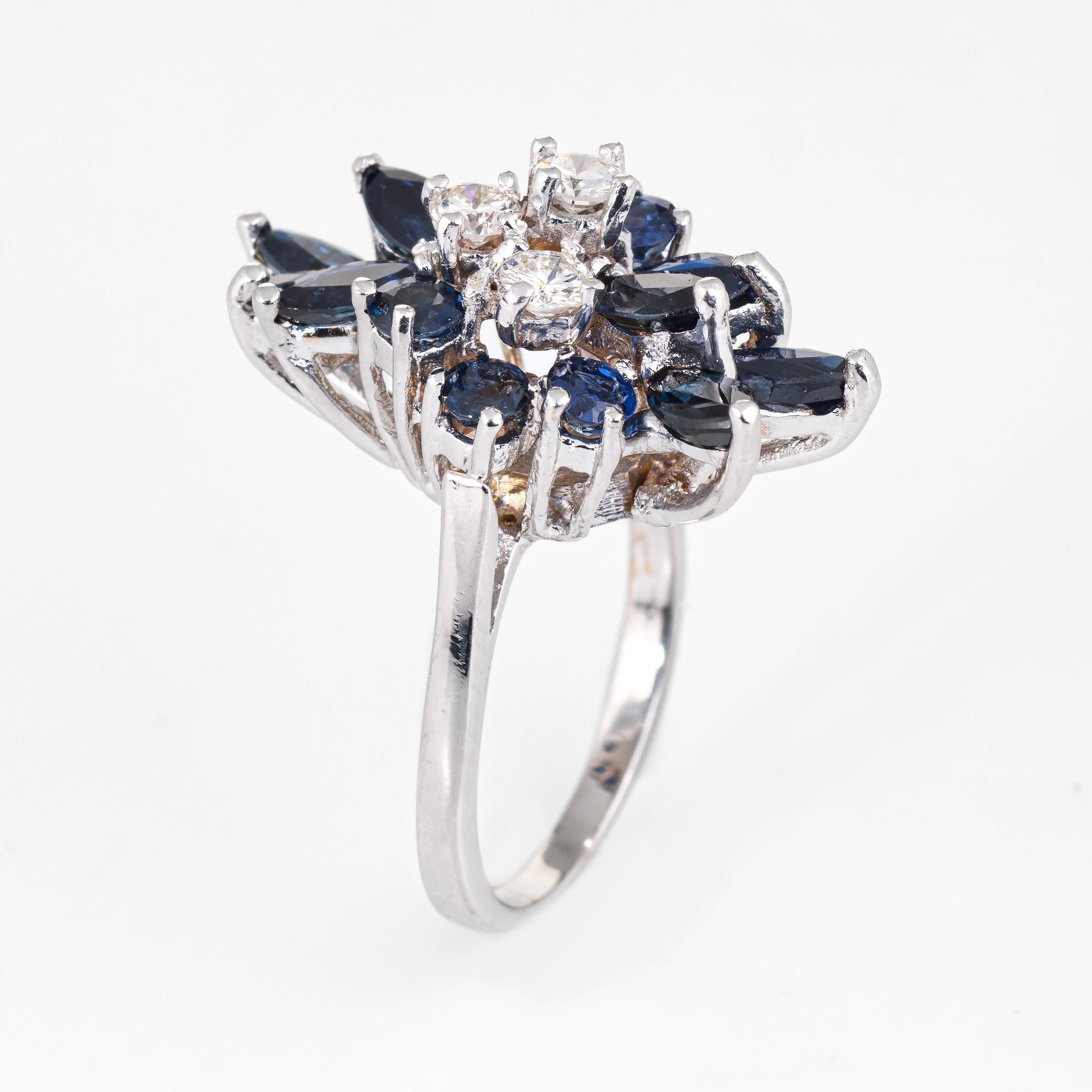 Elegant vintage sapphire & diamond cocktail ring (circa 1960s to 1970s), crafted in 14 karat white gold. 

Marquise and round cut sapphires total an estimated 2.35 carats, accented with an estimated 0.30 carats of diamonds (estimated at I-J color
