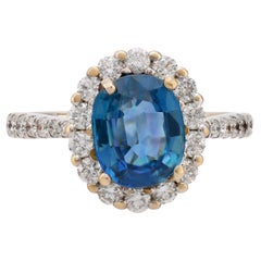 Bague halo vintage en or blanc 18 carats avec saphirs et diamants